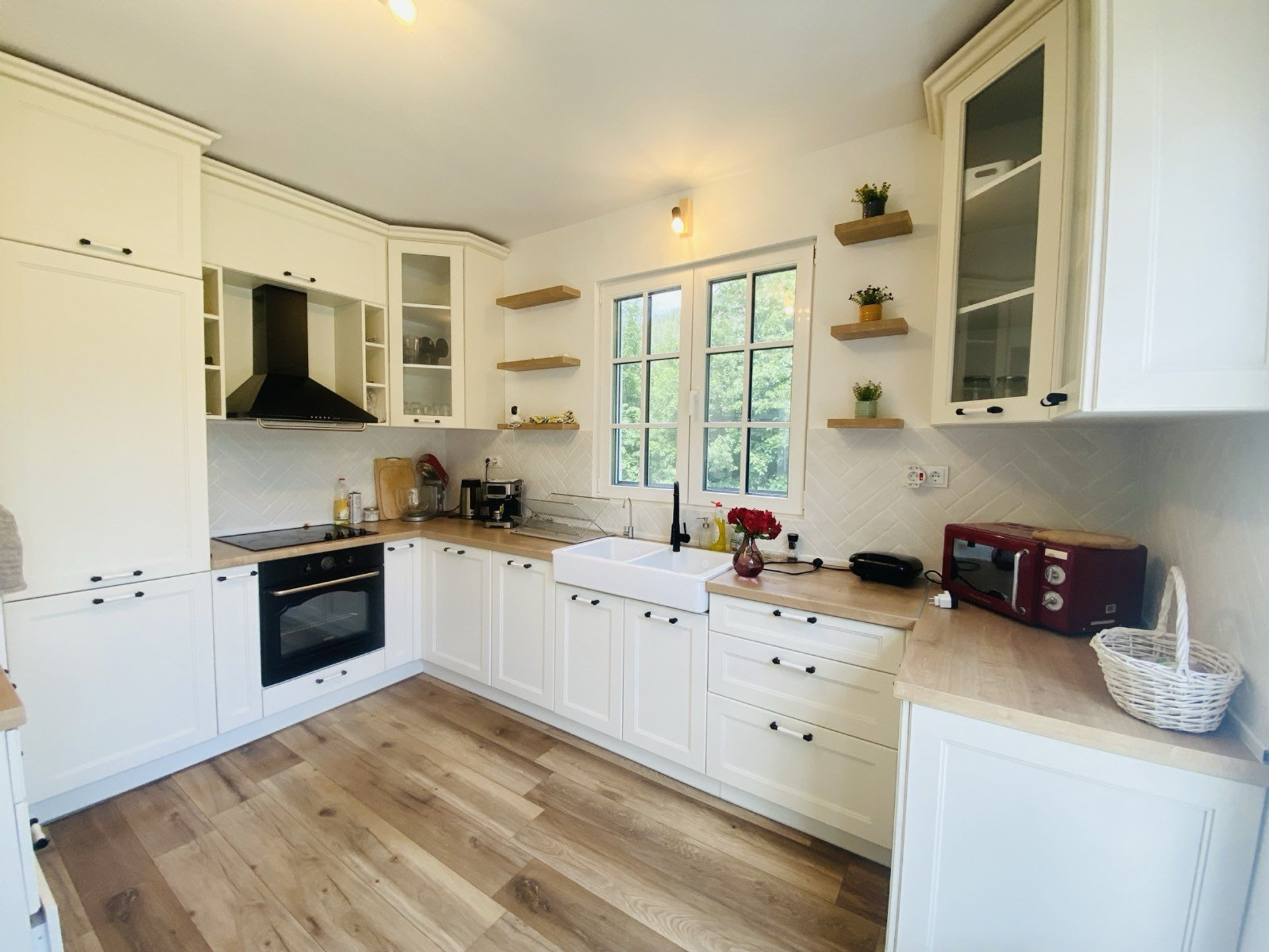 Bright white kitchen with wood countertops