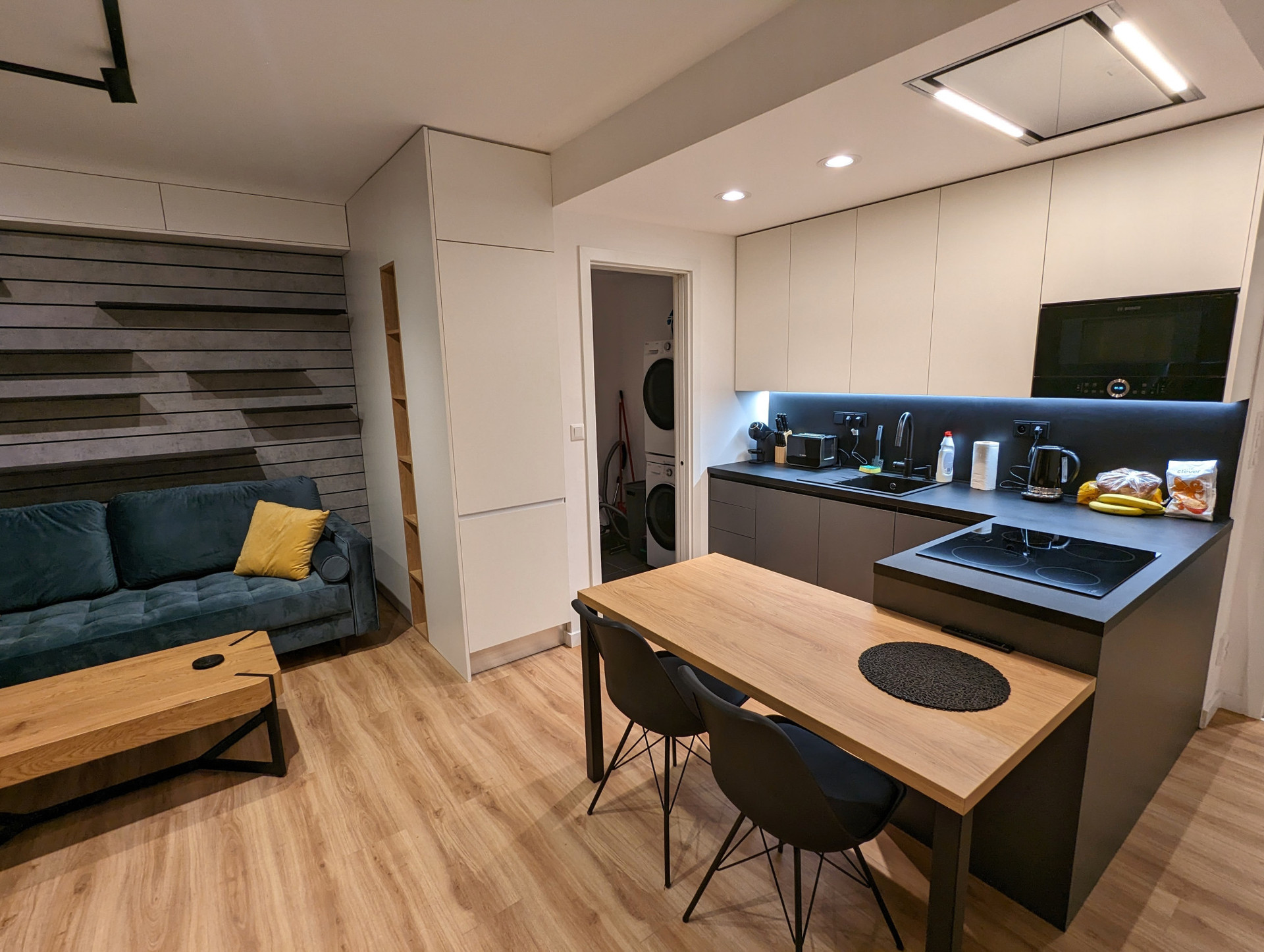 Other view from the Living Room. Dining table and utility closet can be seen.
