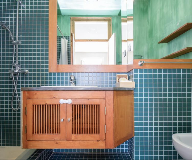 Green tiled bathroom shower