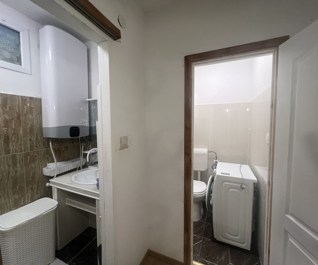 Bathroom with sink and washer