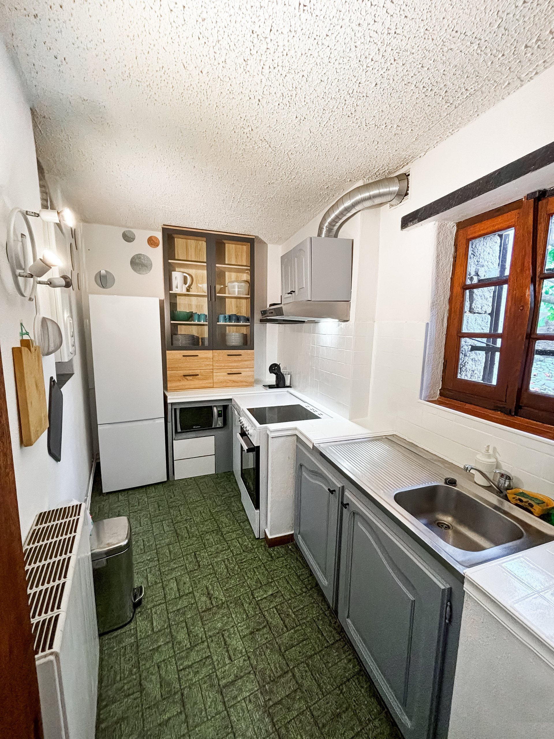 Compact kitchen with appliances and storage