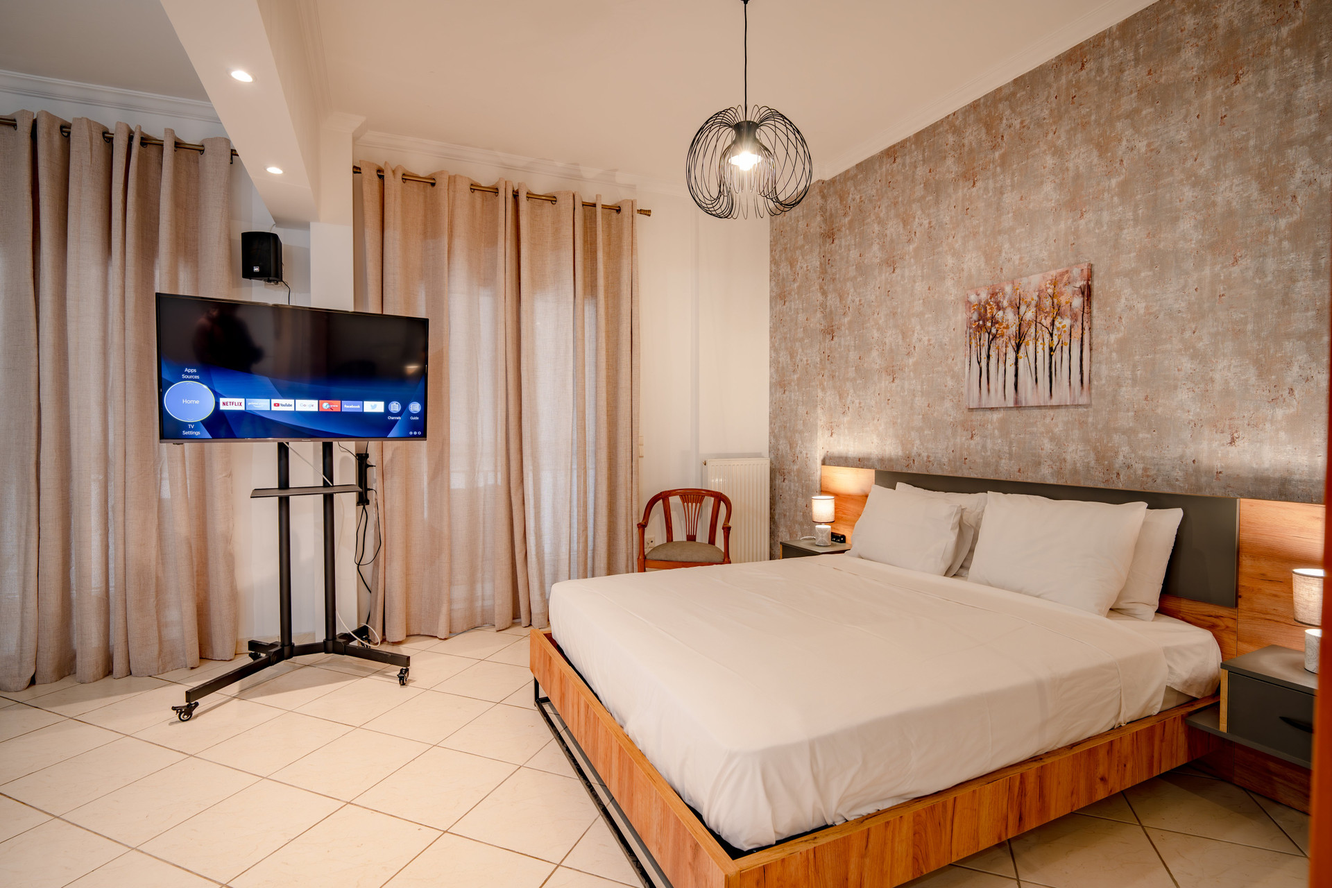 Bedroom with TV and bed