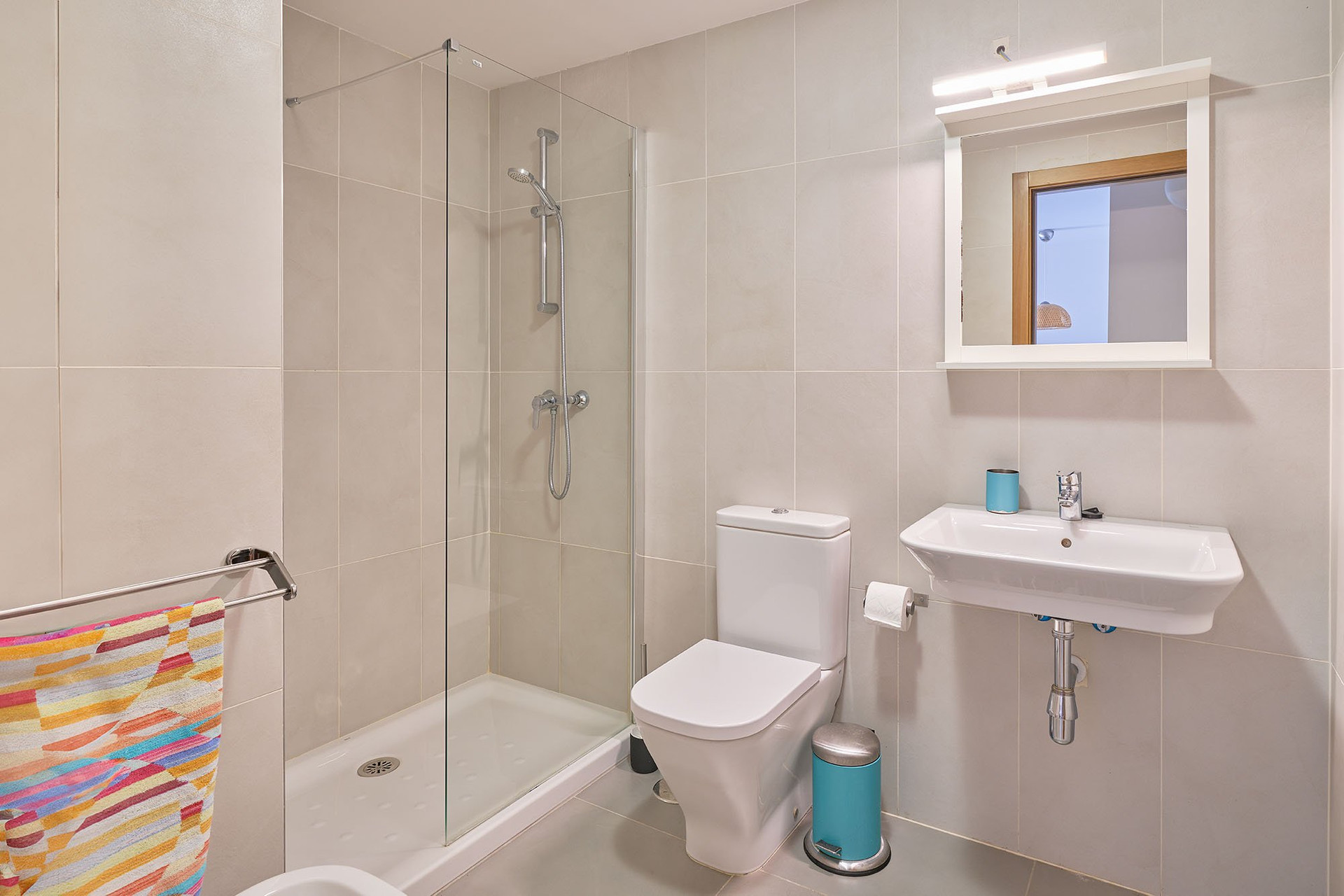 Clean bathroom with walk-in shower