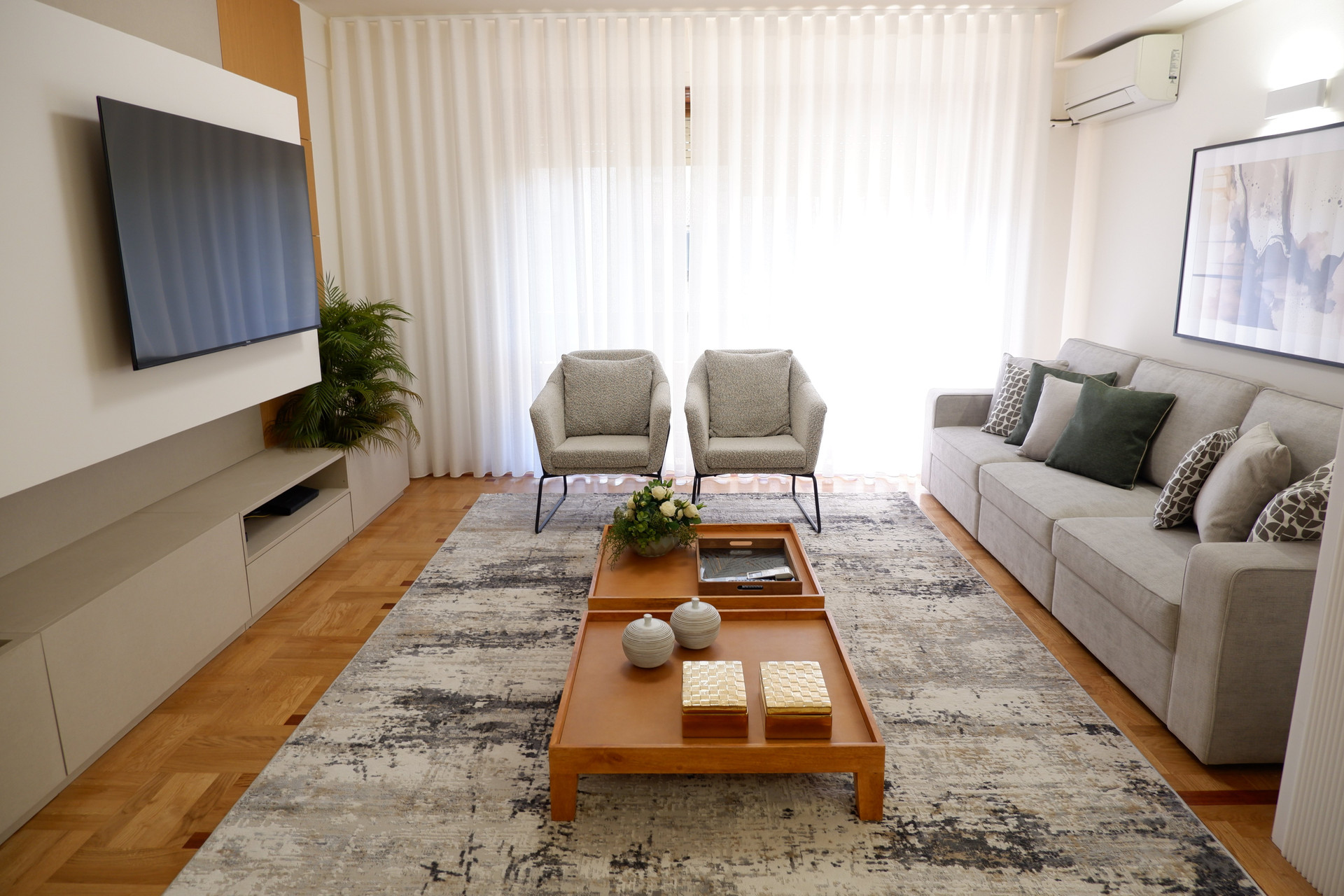 Spacious living room with TV