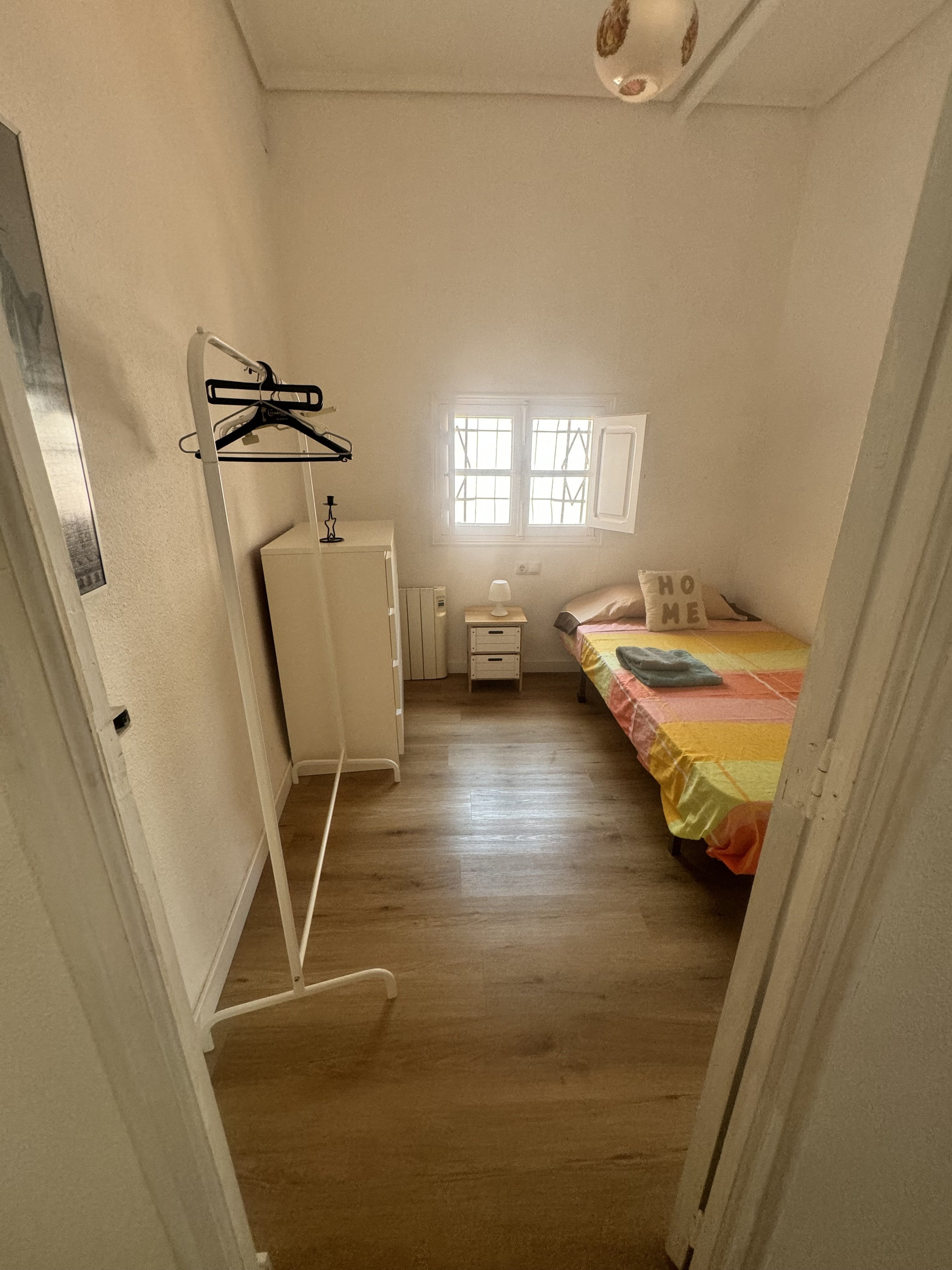 Bright bedroom with single bed