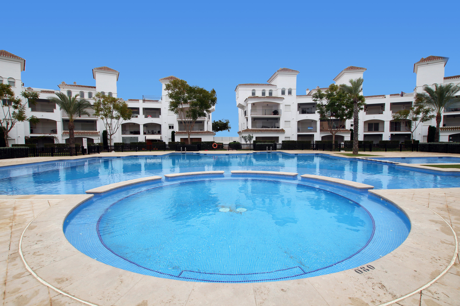 Community pool with buildings