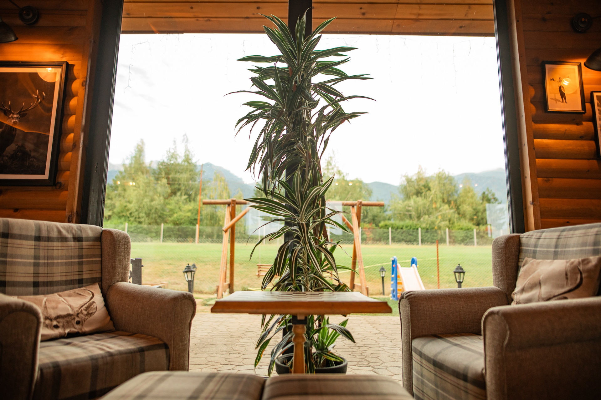 A peaceful seating area overlooking the garden and mountains. Perfect for a coffee break or quiet relaxation.