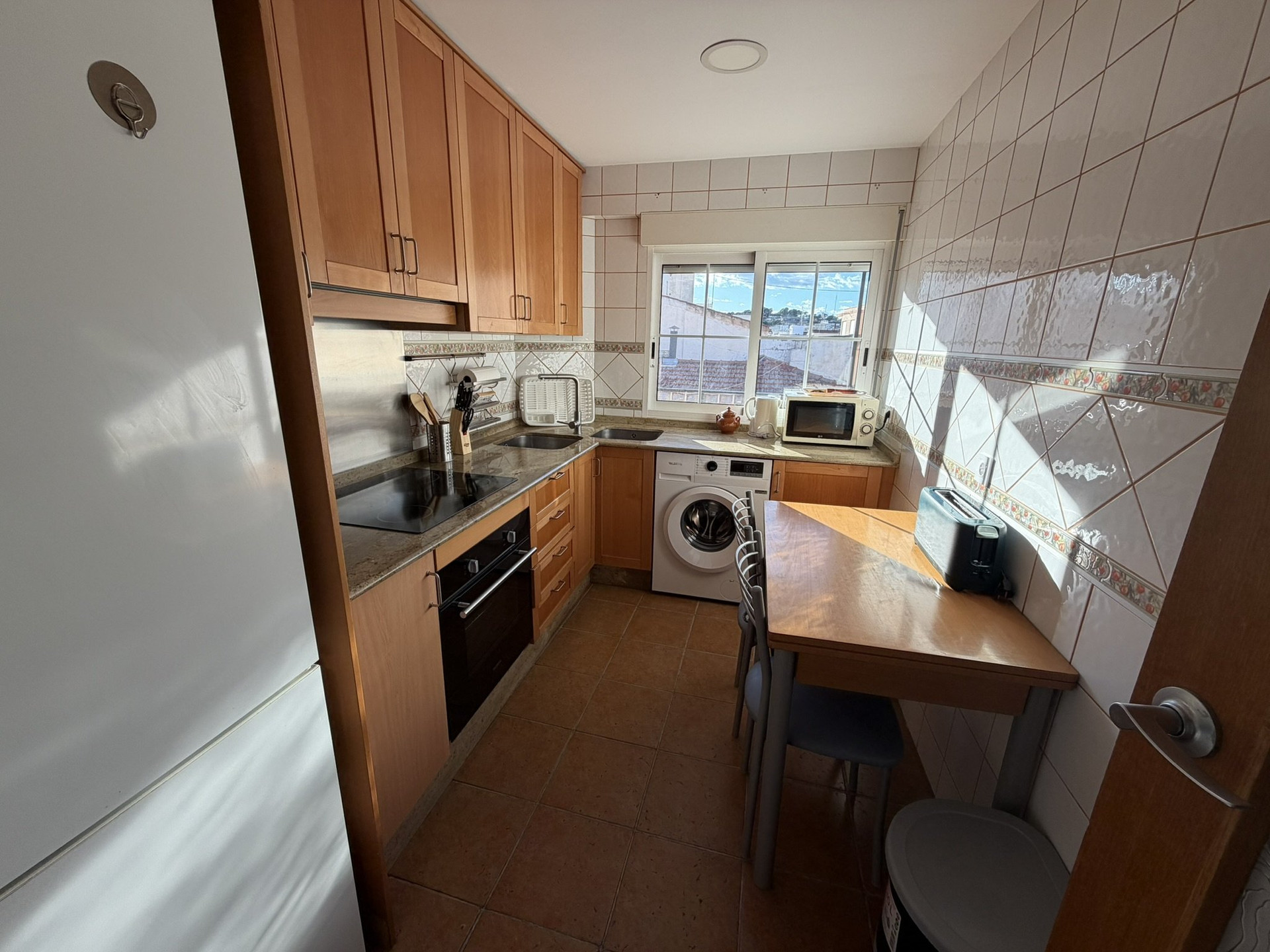 Compact kitchen with dining table