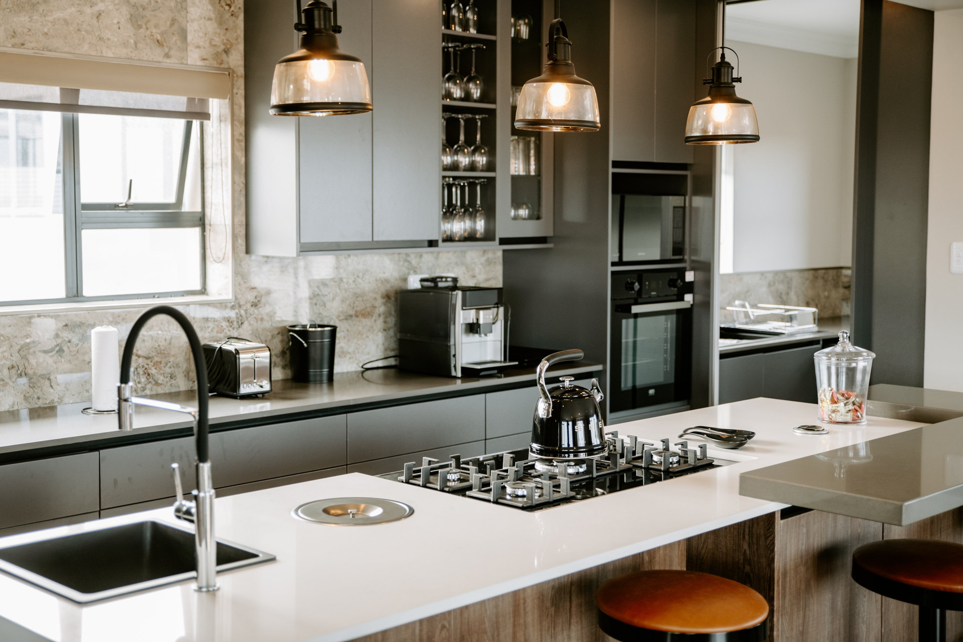 Kitchen with gas hob and pendants