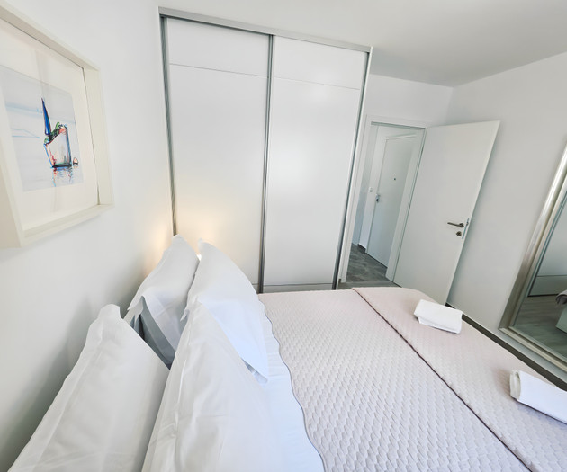 Bedroom with wardrobe and mirror