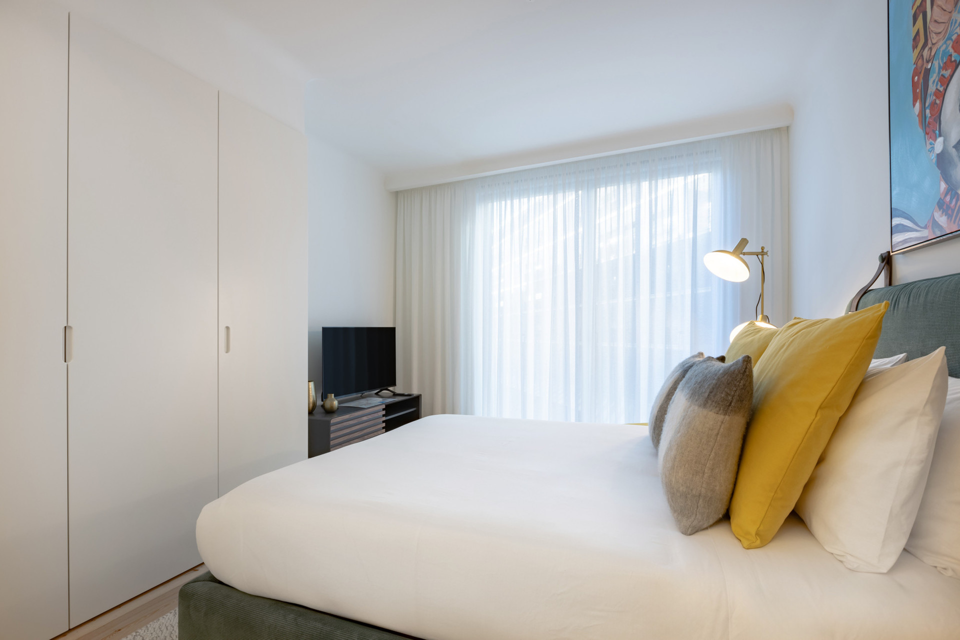 Living Area with a Double Bed, Wardrobe and TV
