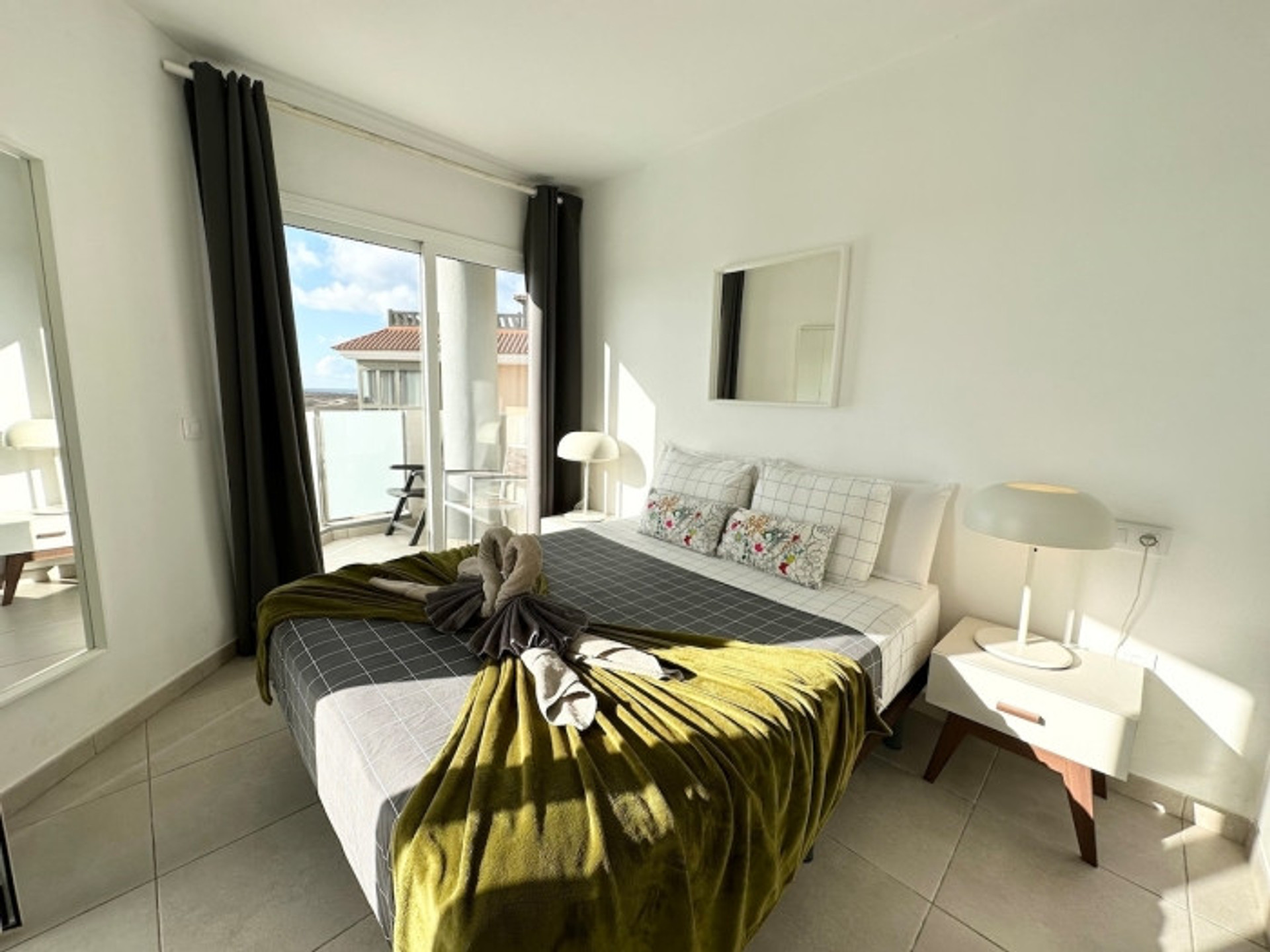 Bright bedroom with balcony access