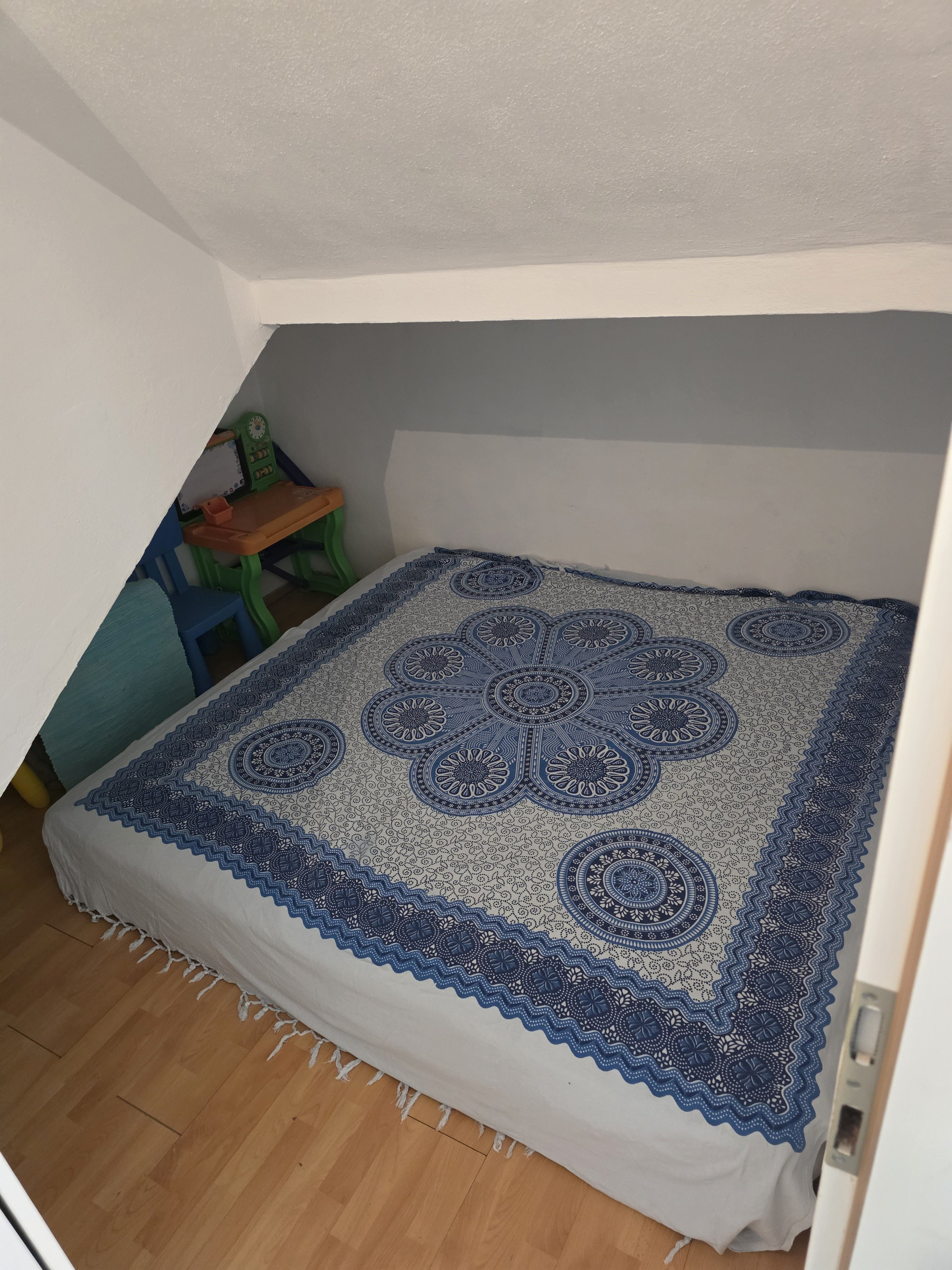 Bedroom with patterned bedspread