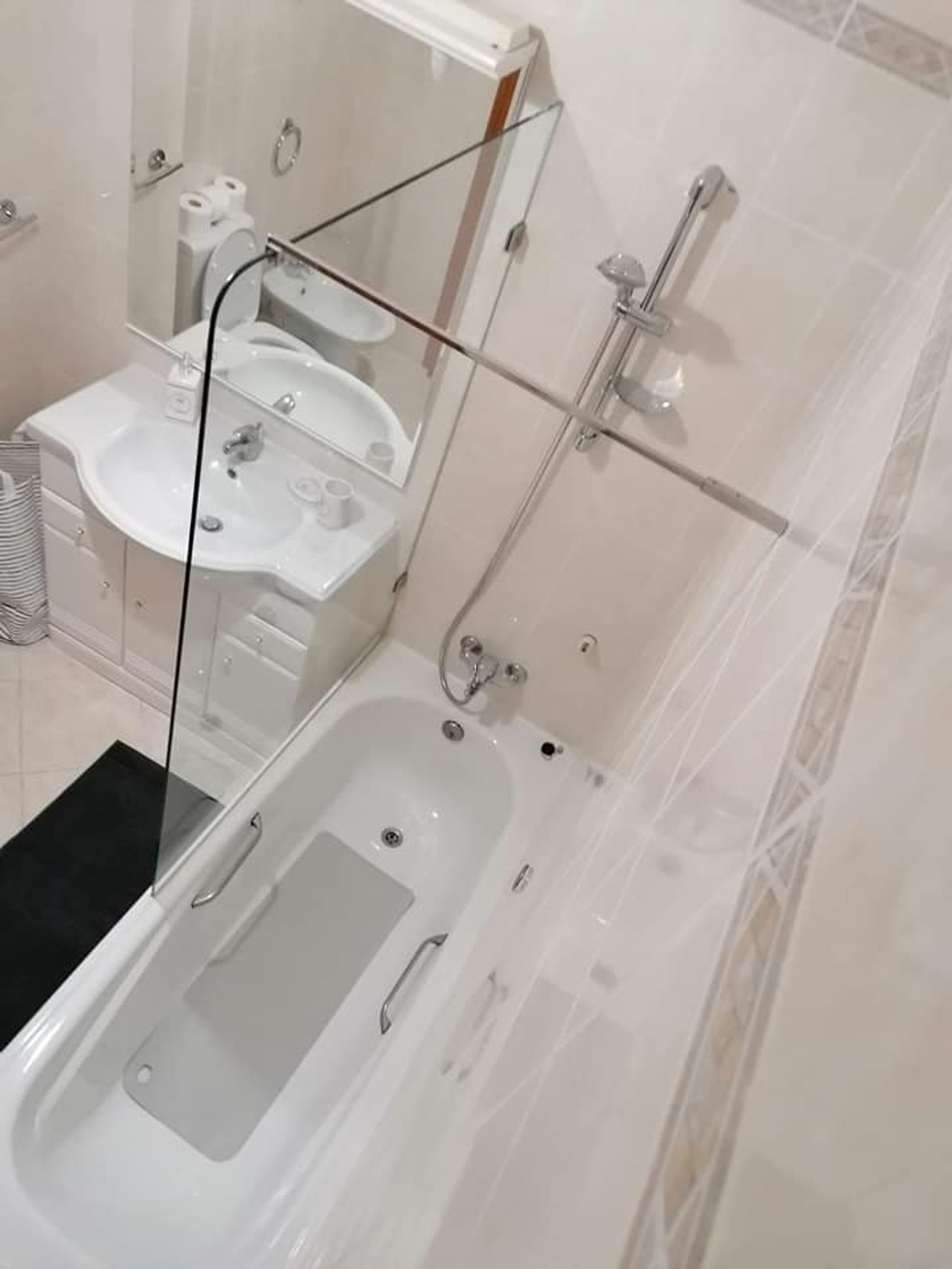 Bathroom with bathtub and shower