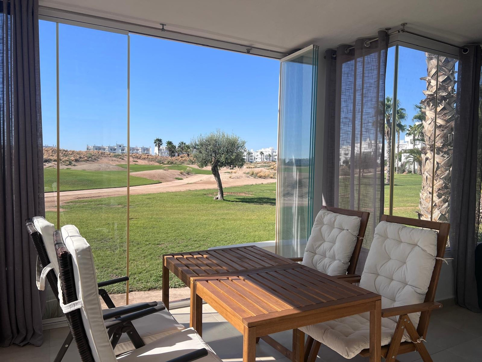 Glazed terrace overlooking golf course