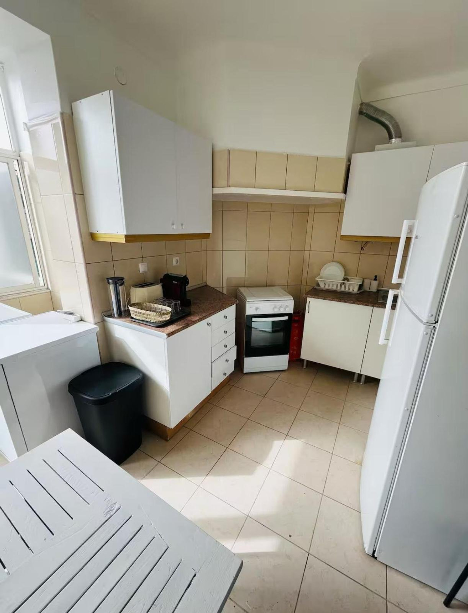 Kitchen with white cabinets and stove