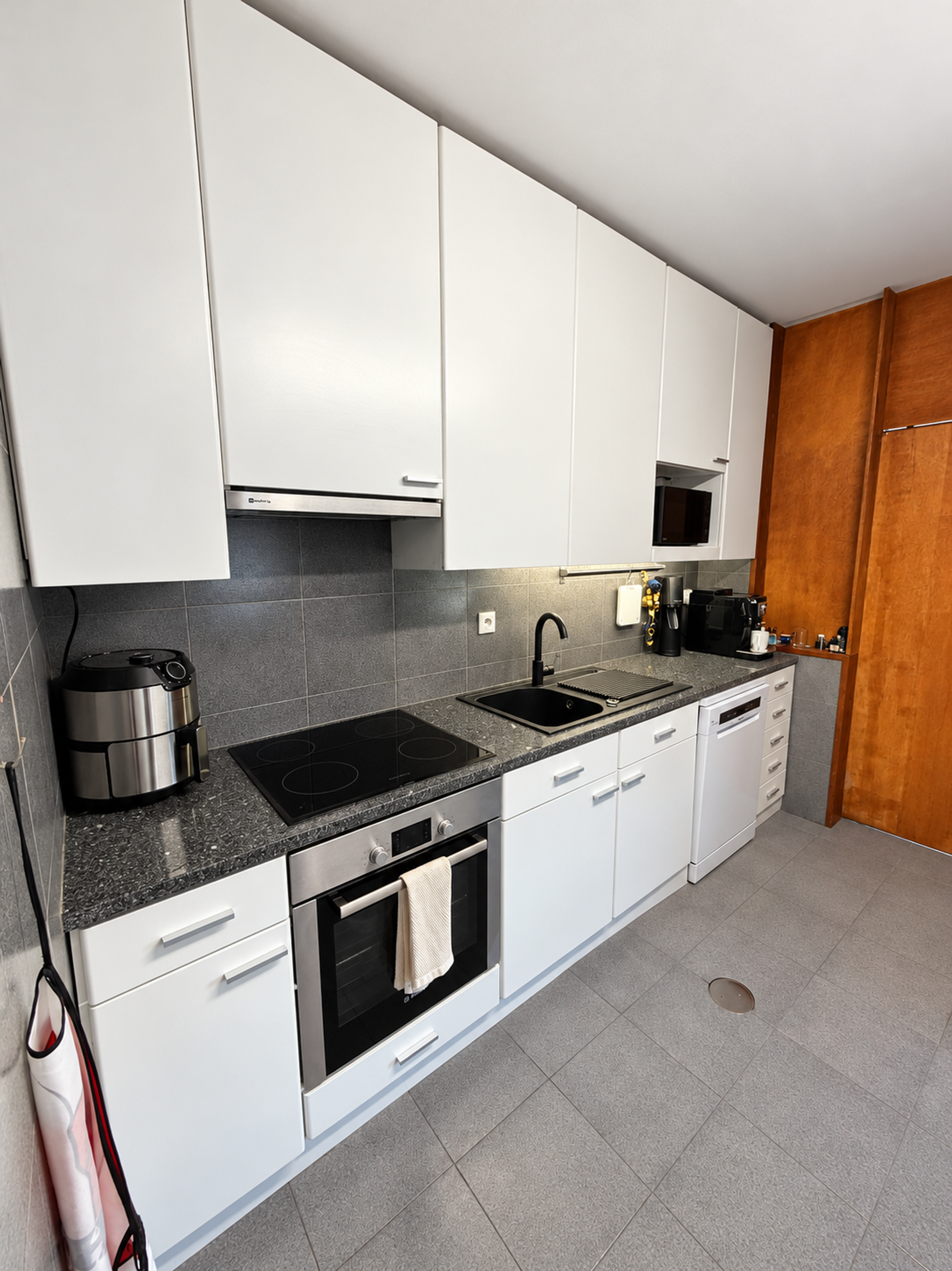 Modern white kitchen with appliances