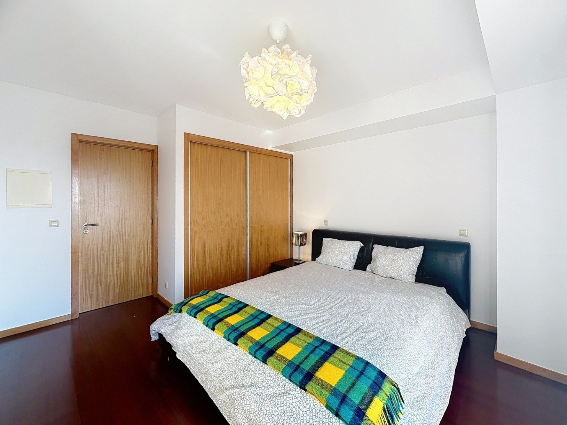 Bedroom with wardrobe and bed