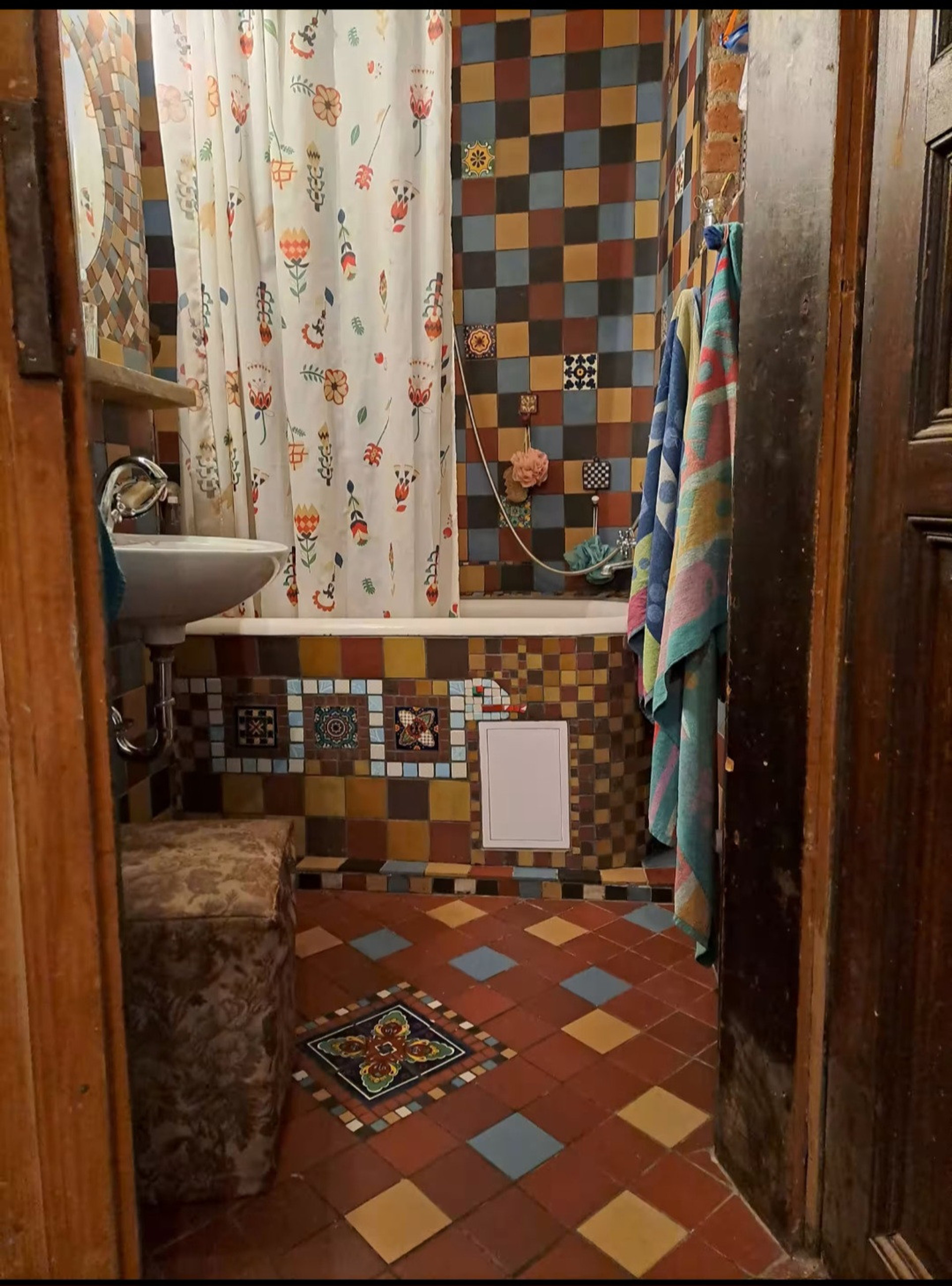 Colorful tiled bathroom with bathtub