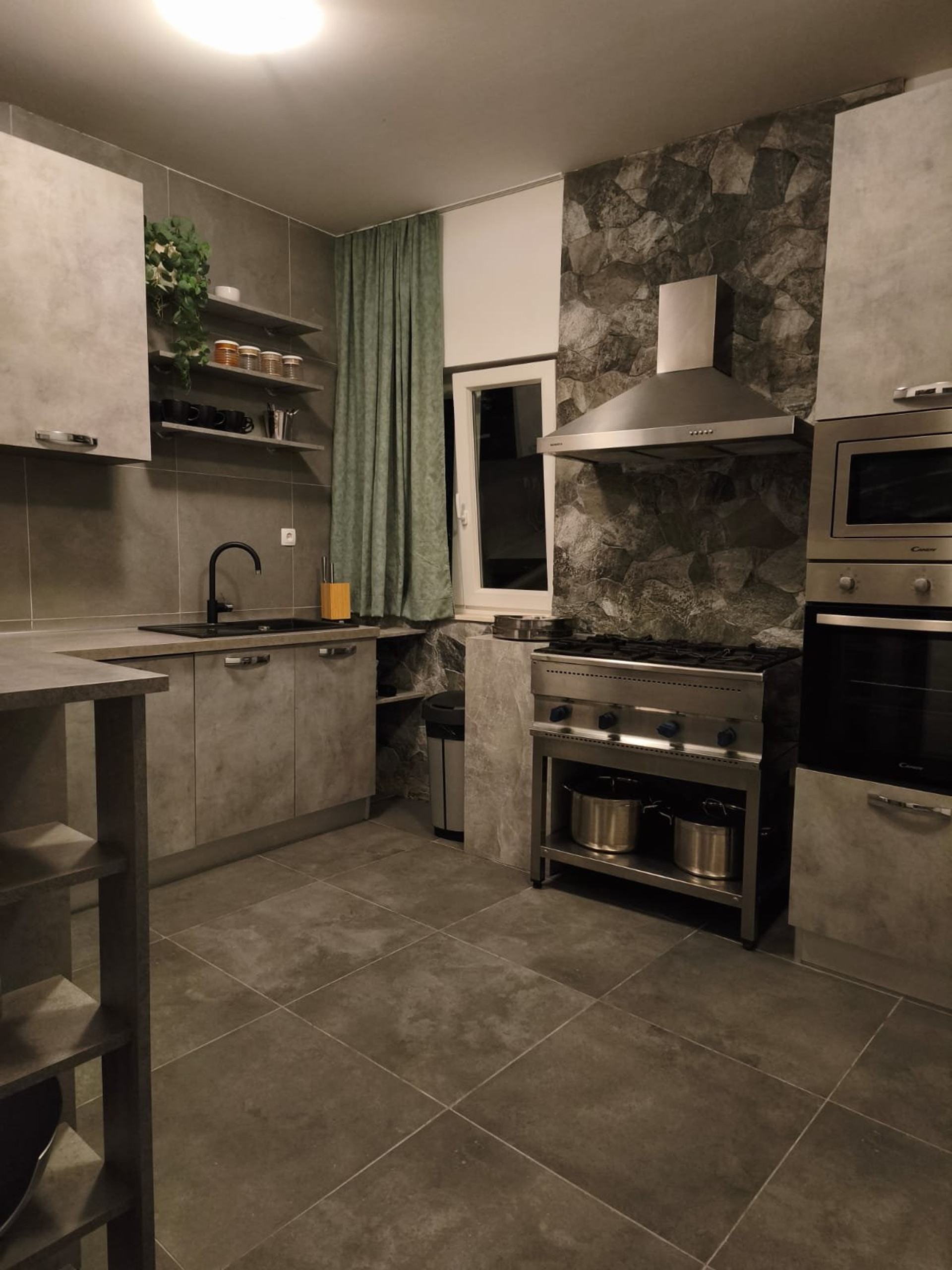 Modern kitchen with stone wall, professional kitchen