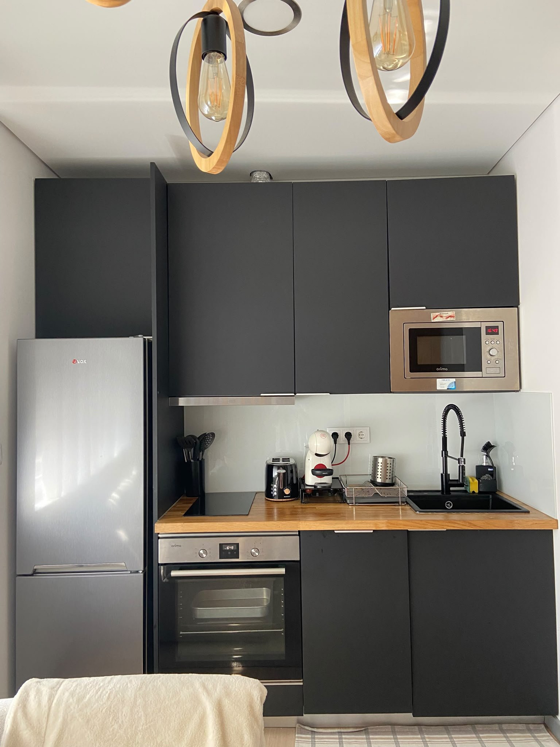 Modern dark kitchen with appliances