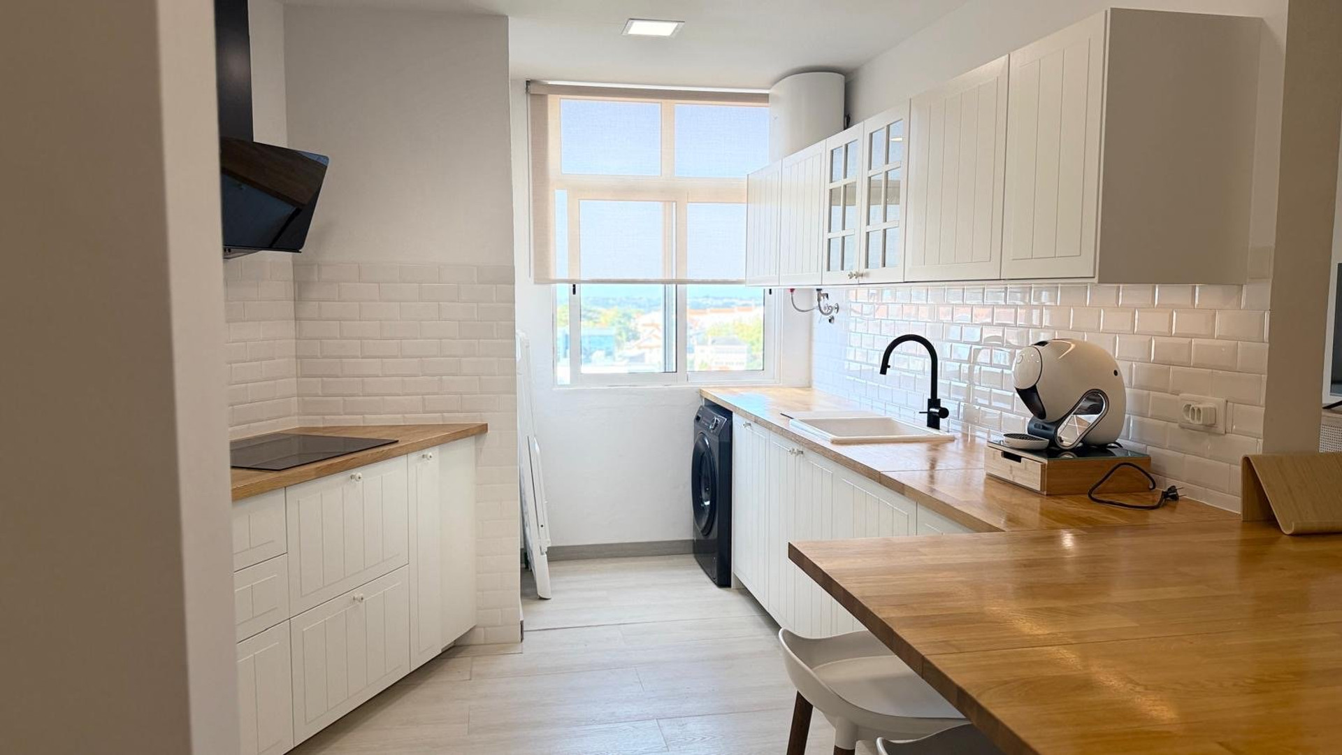 Kitchen with washer and window