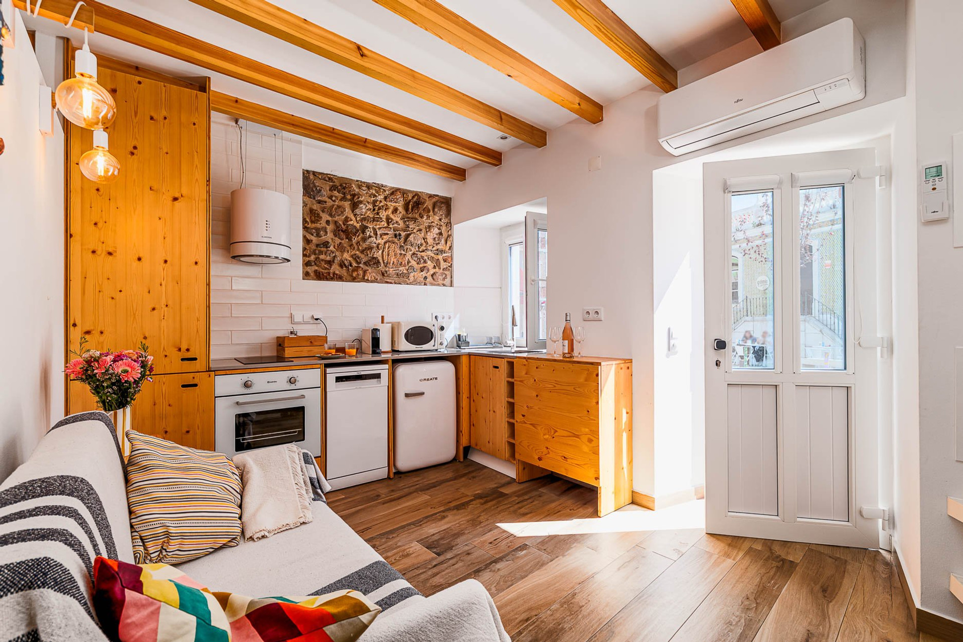 Kitchen with wooden cabinetry, seating