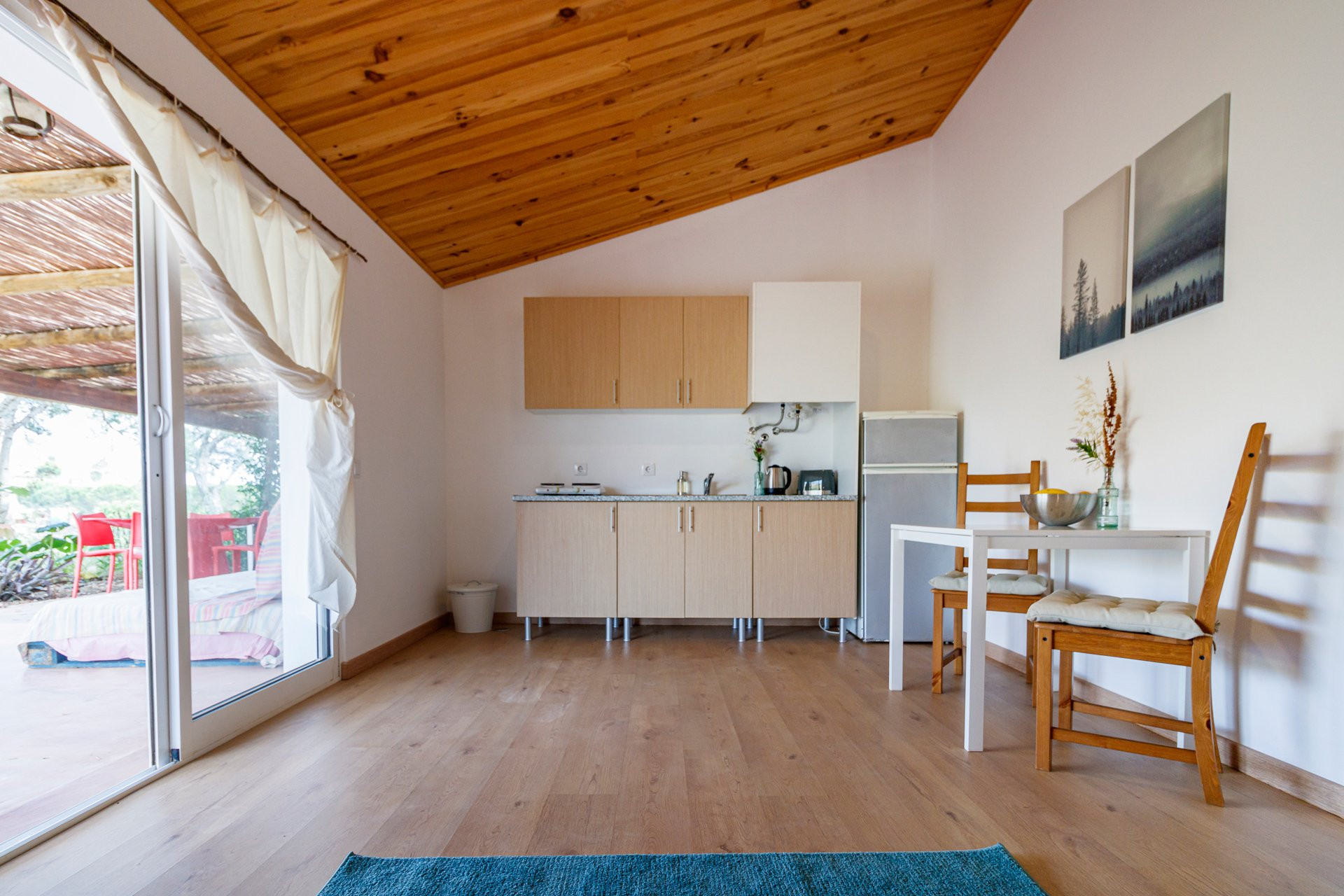 Open kitchen dining with terrace access