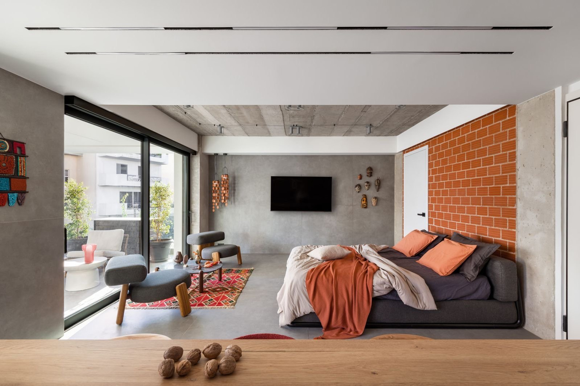 Bedroom with living area and TV