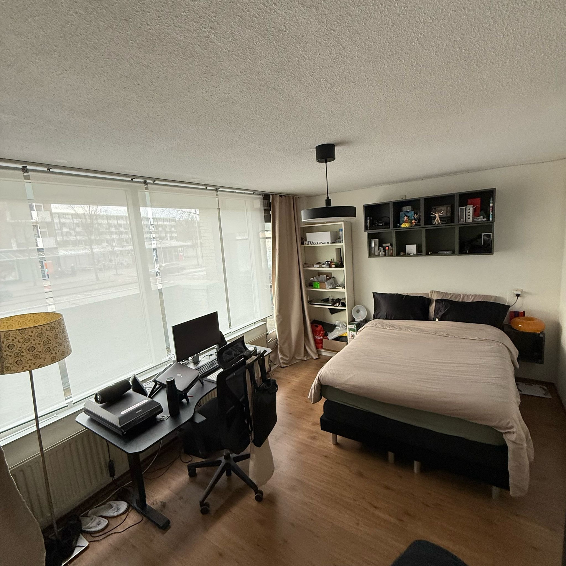 Bright bedroom with large windows