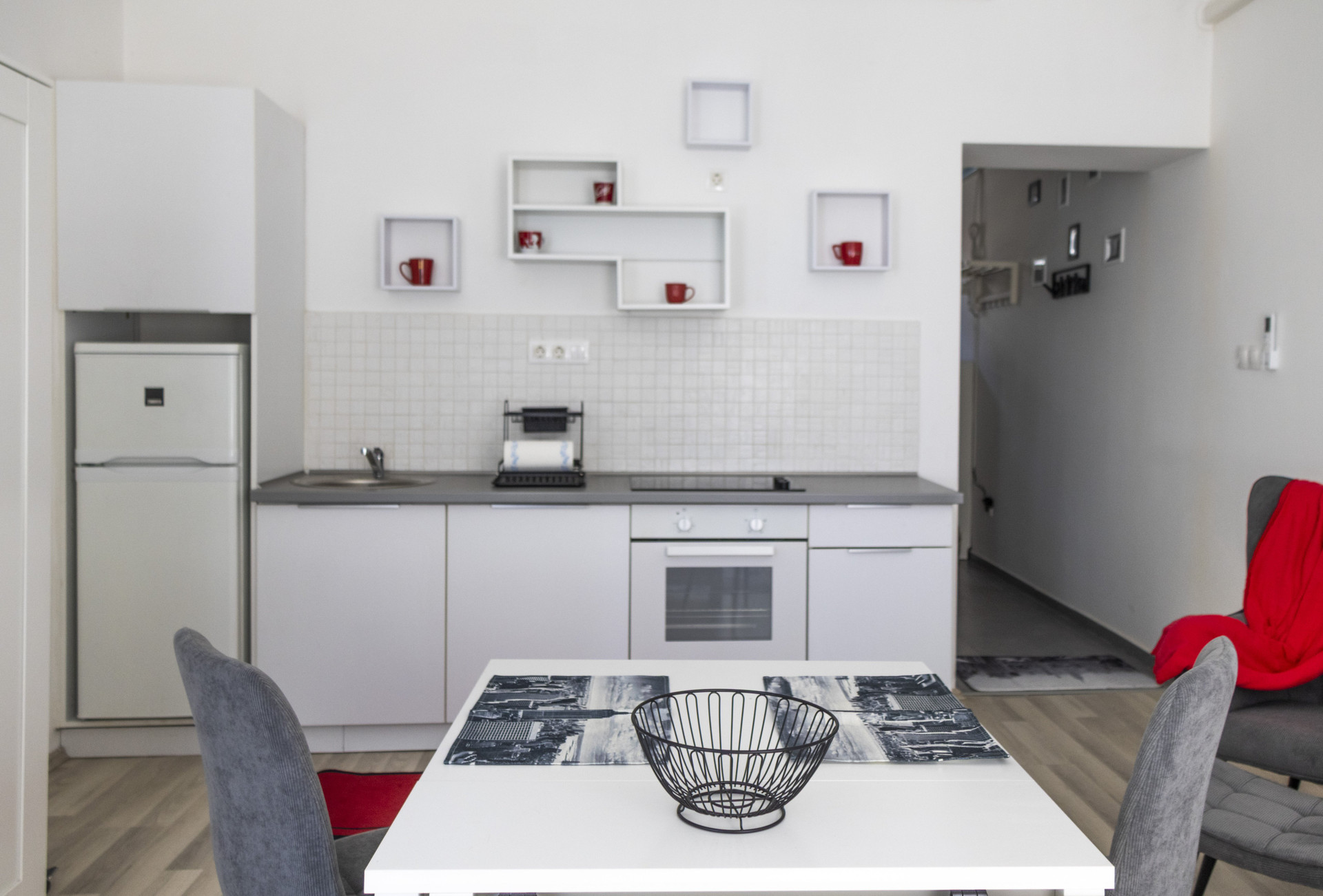 Kitchen with red mug shelves