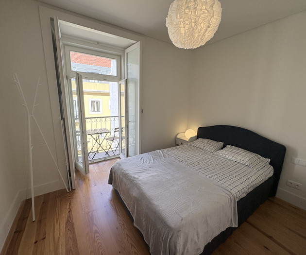 Bedroom with balcony and lamp