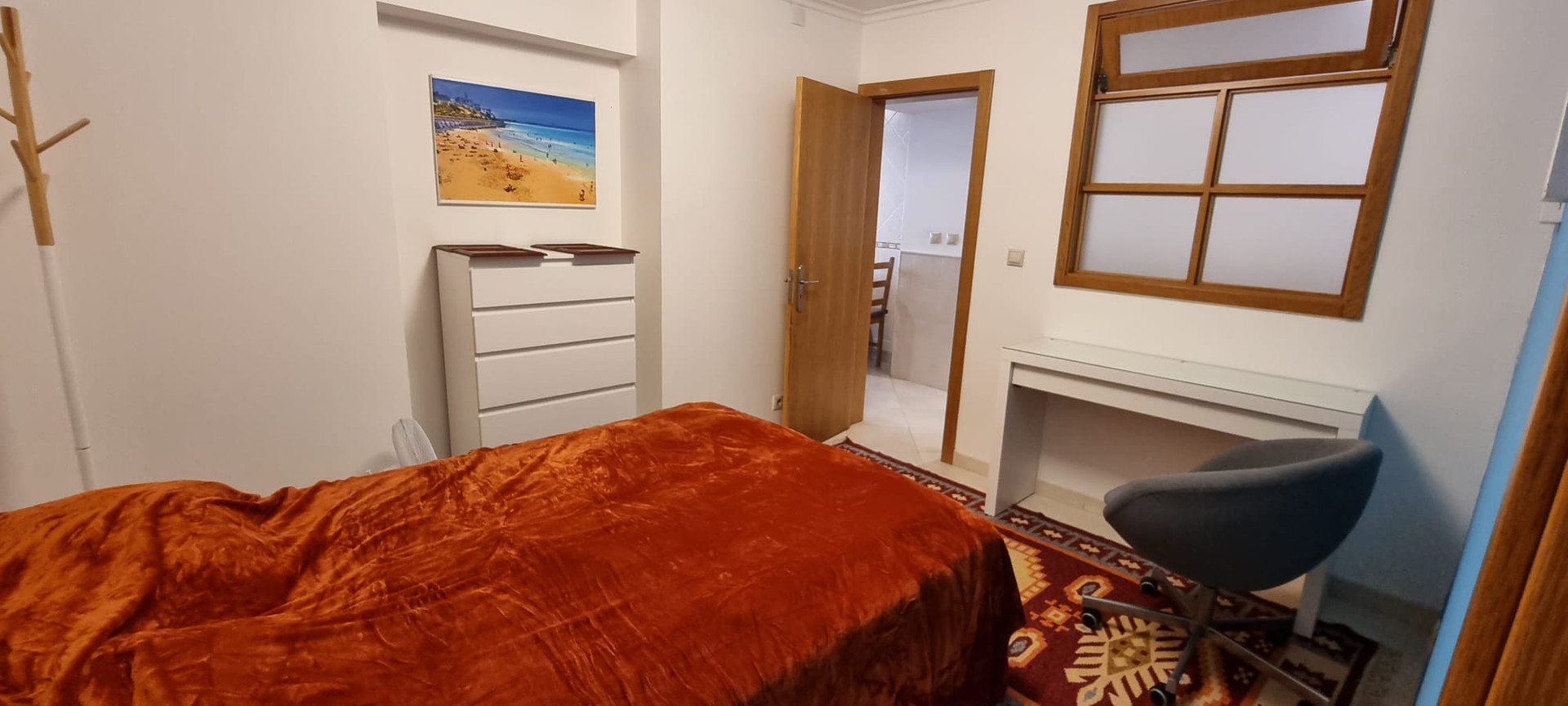 The secondary double bedroom with a storage closet