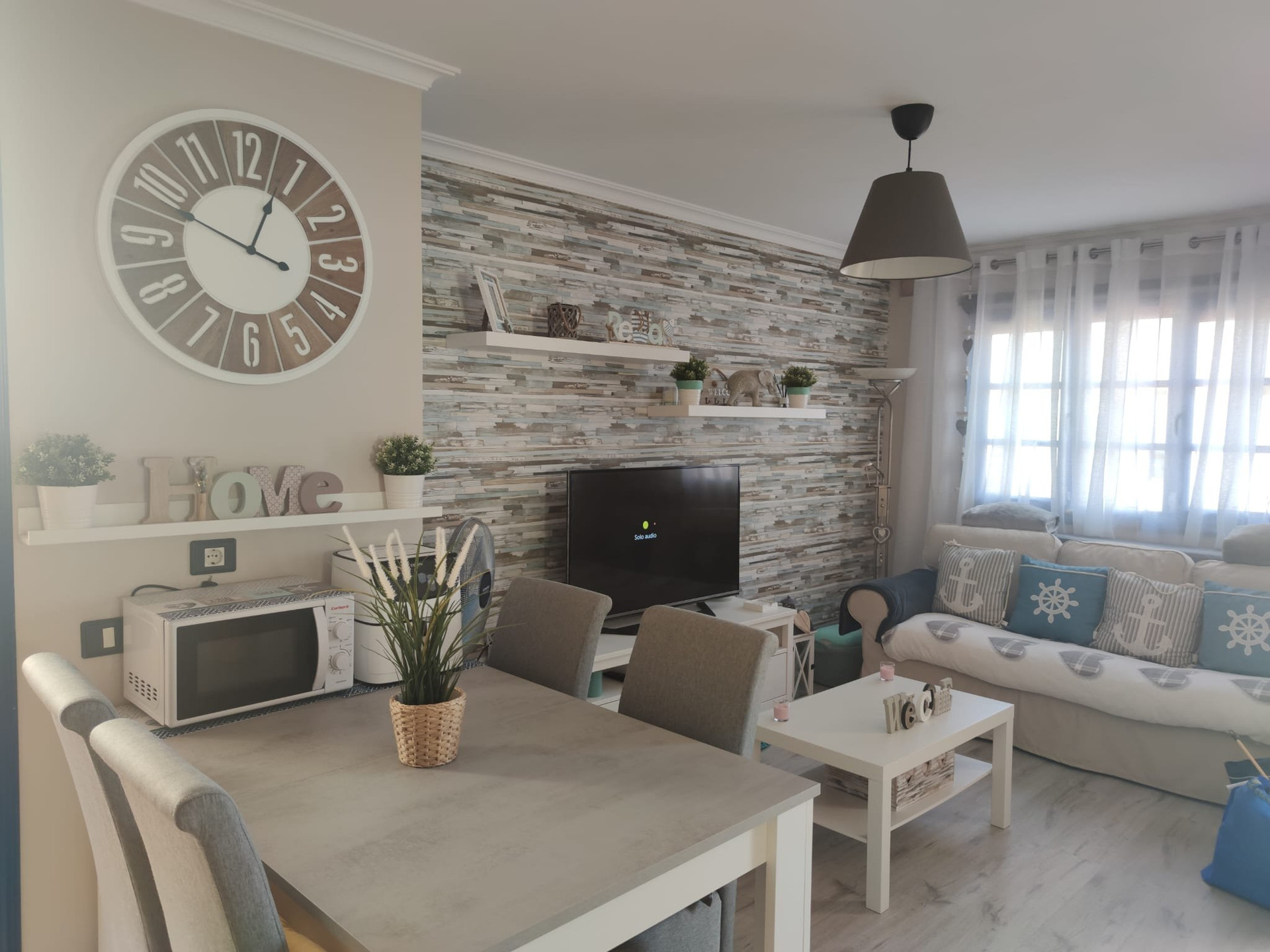 Open living dining area with TV