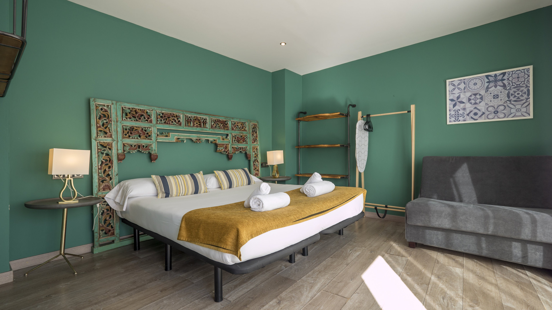 Double bed full room green walls