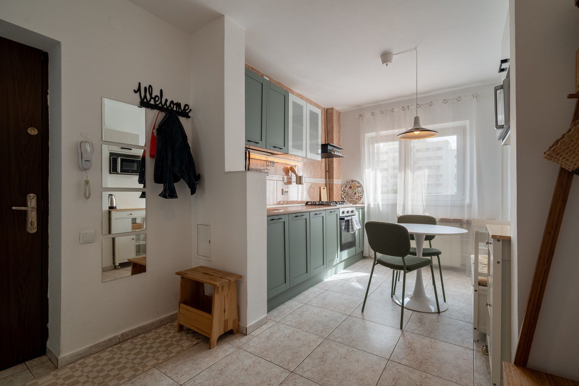 Kitchen with dining table, entrance