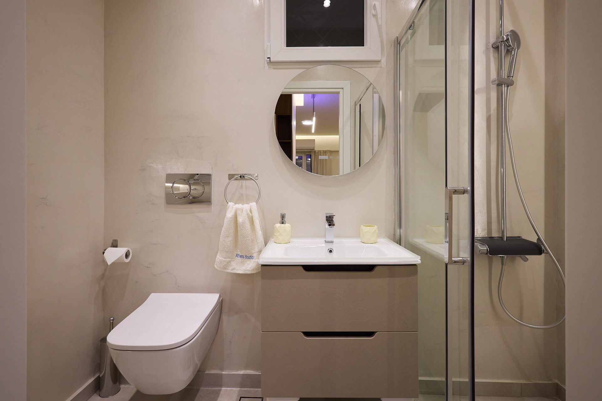 Bathroom with toilet, sink, shower