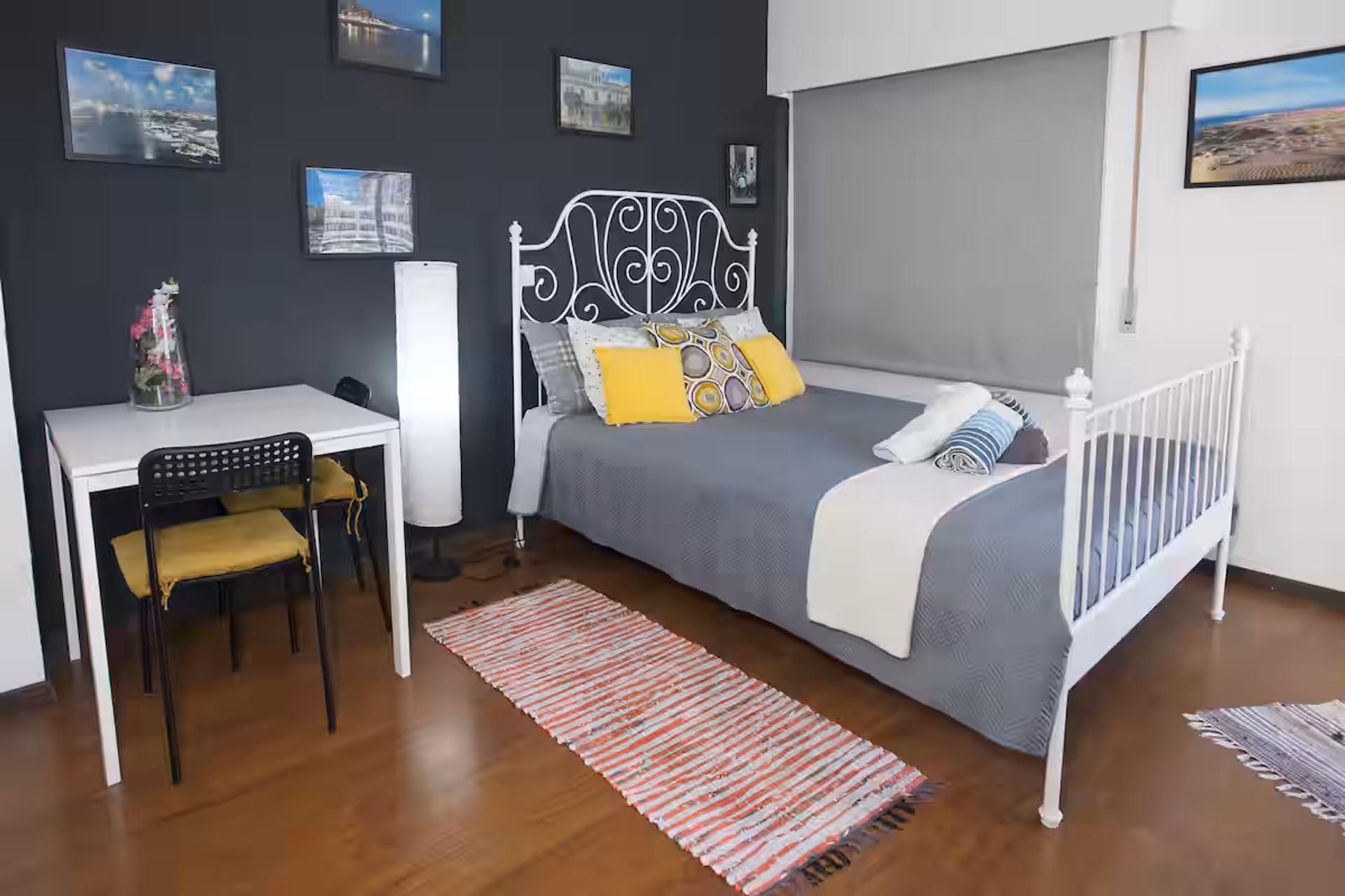 Bed area with dark accent wall