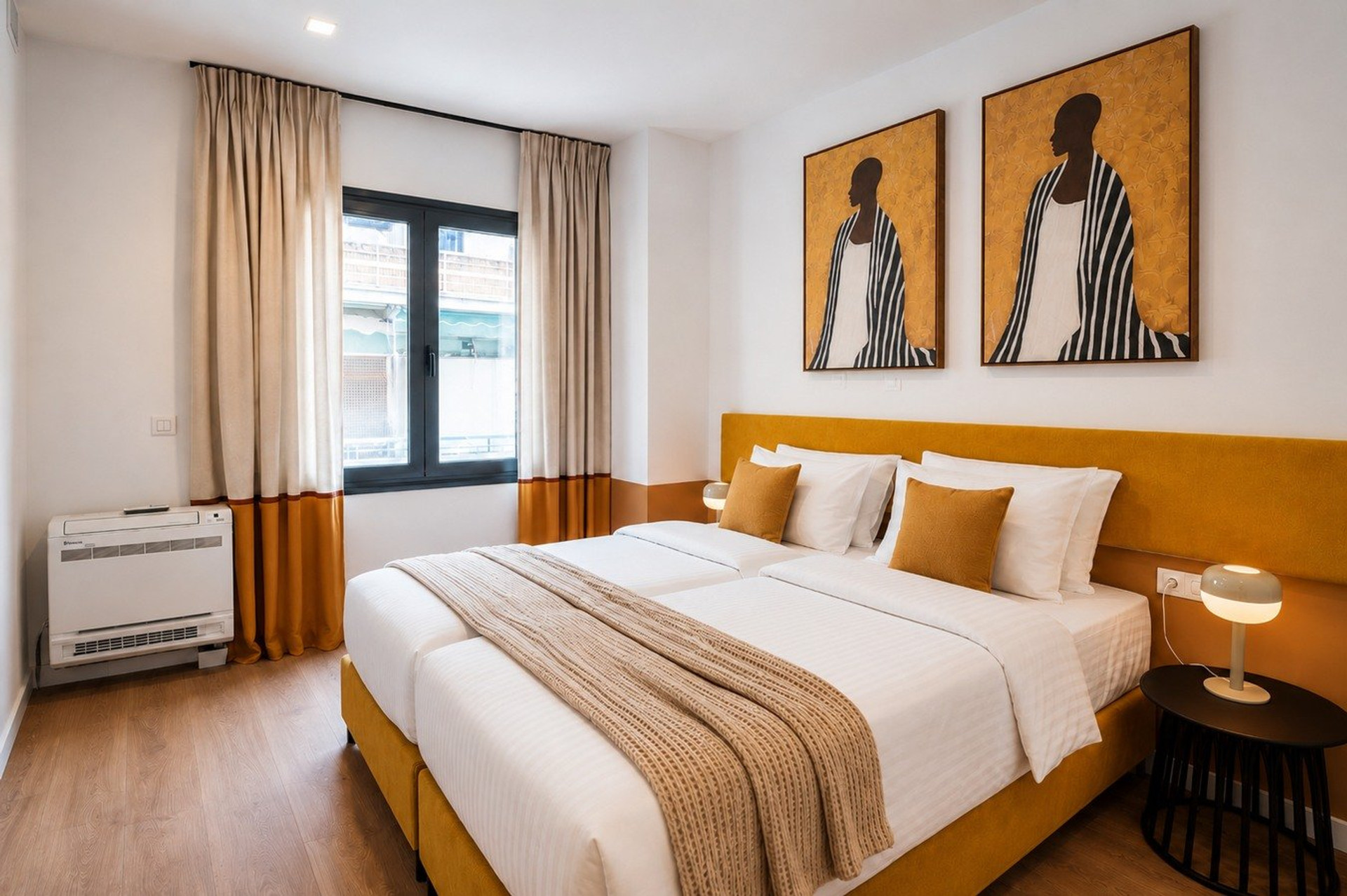 Twin beds with artwork above