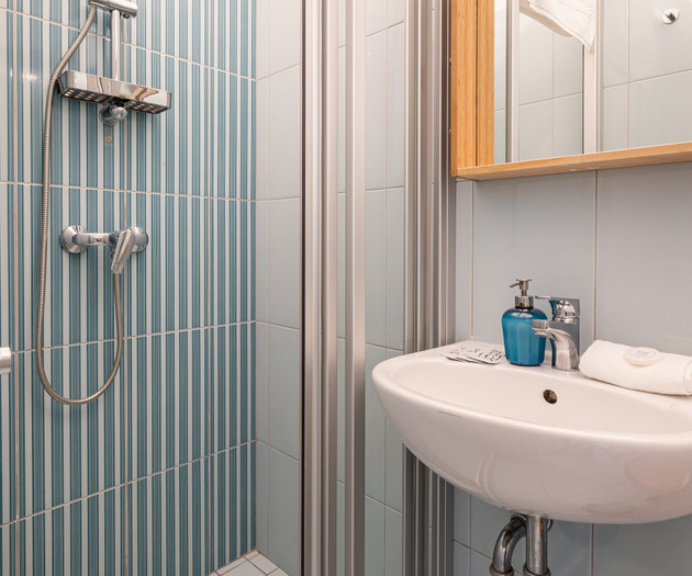Shower cabin and washbasin