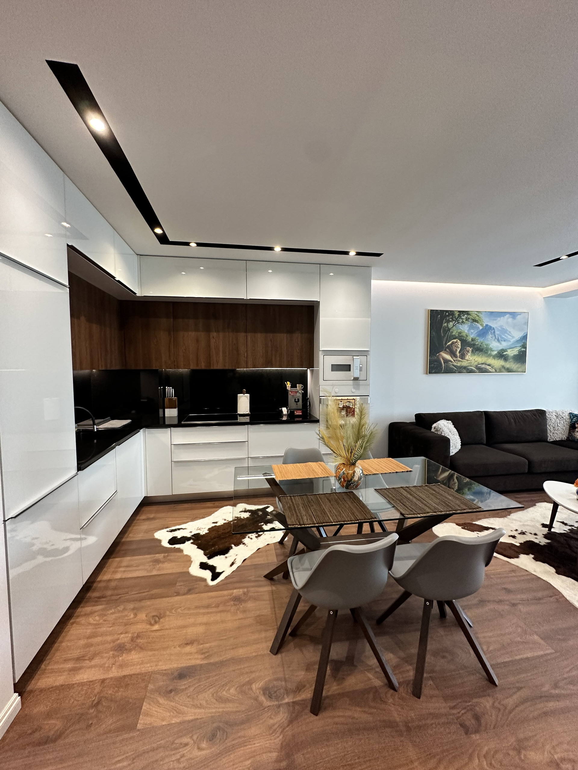 Kitchen, dining area and sofa