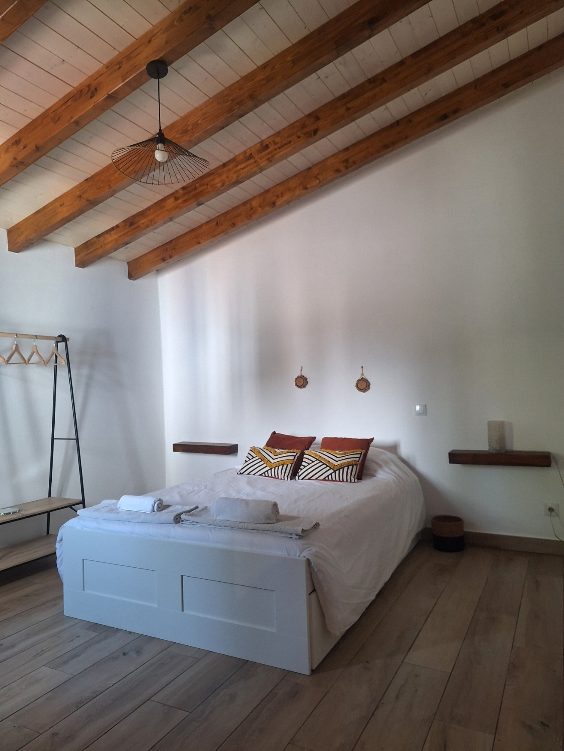 Bedroom with white bed sideways