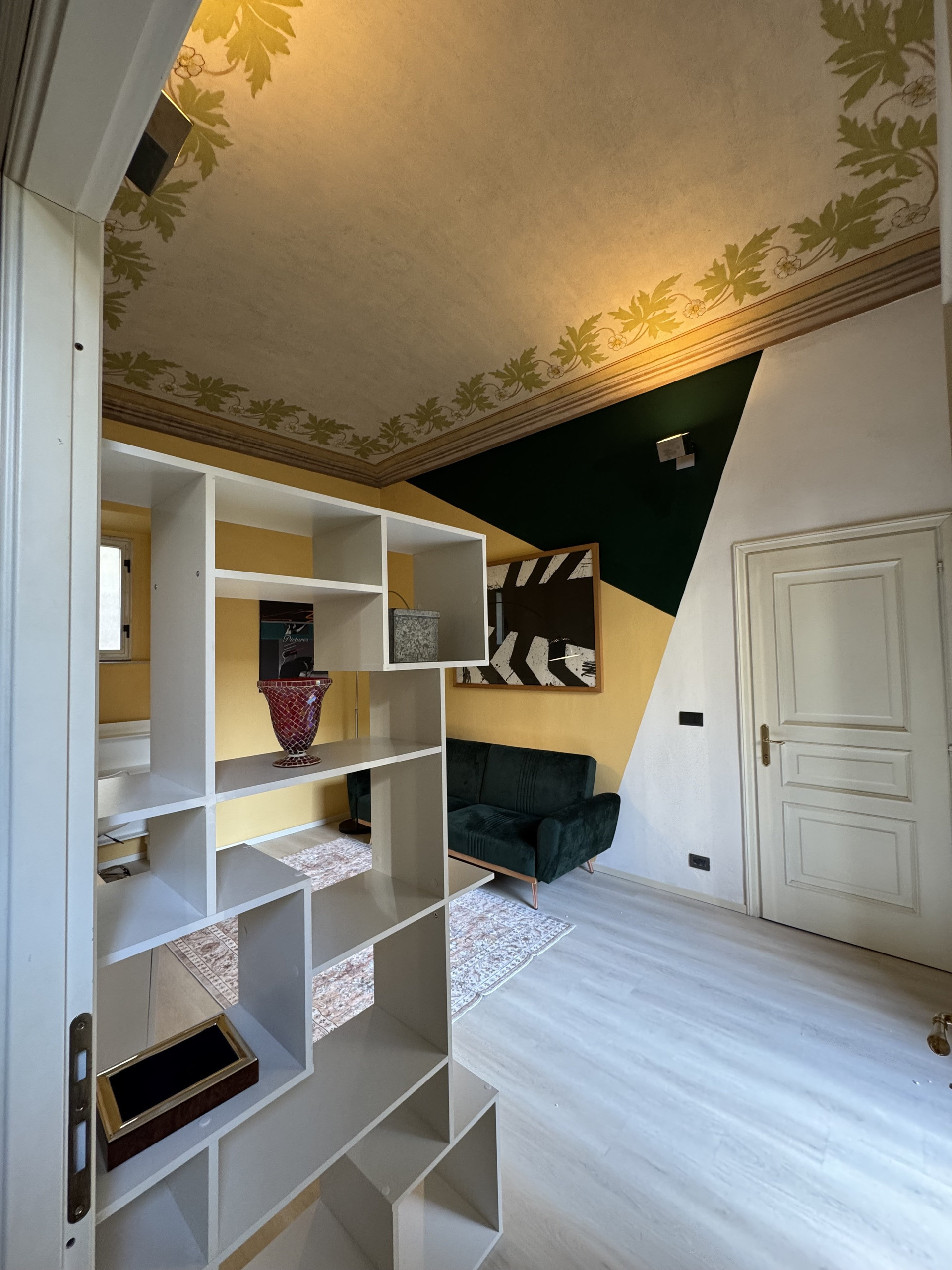 Living room with decorative painted ceiling