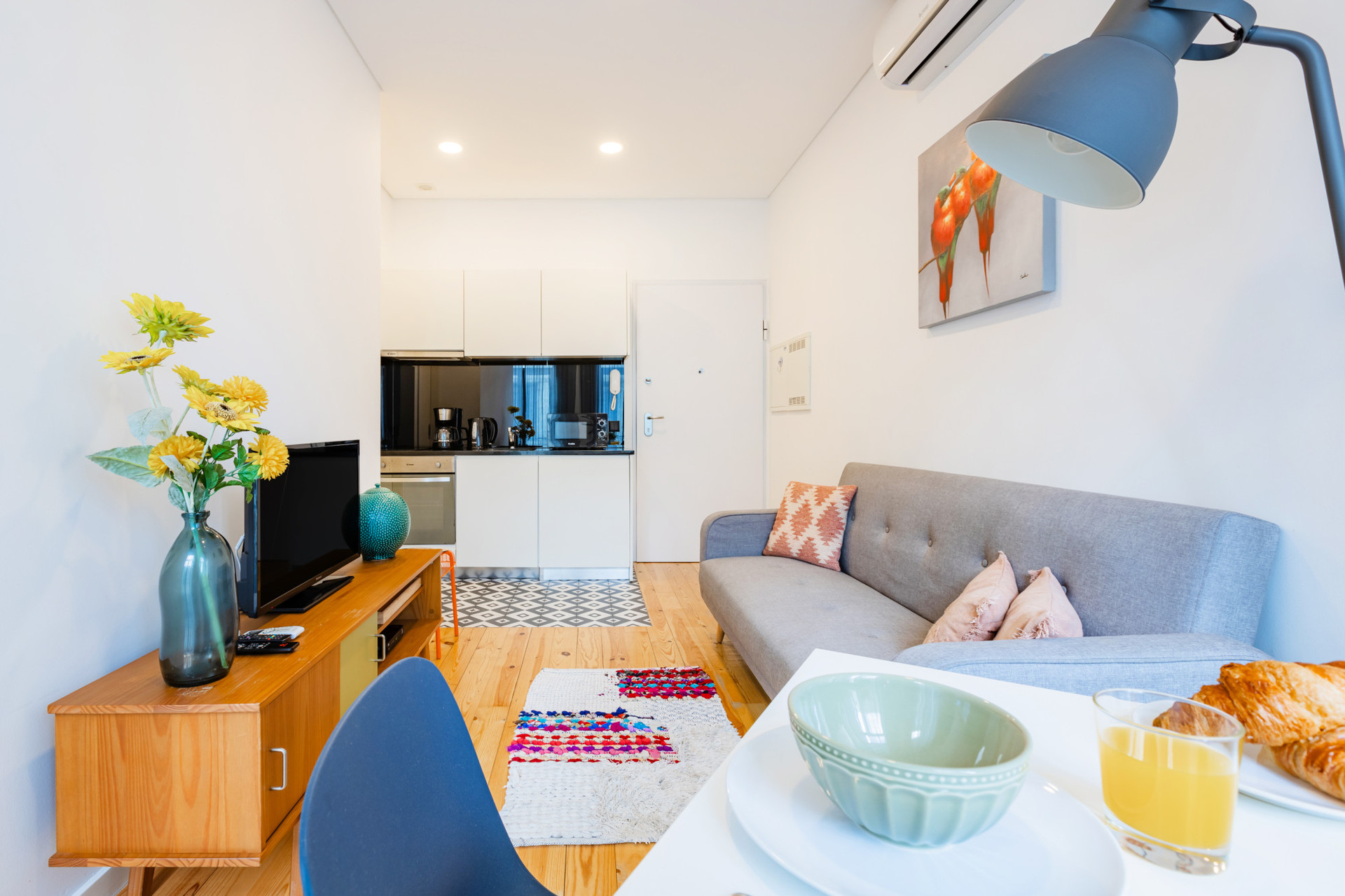 Living Room with a comfortable sofa and TV. Dining Table for 2.