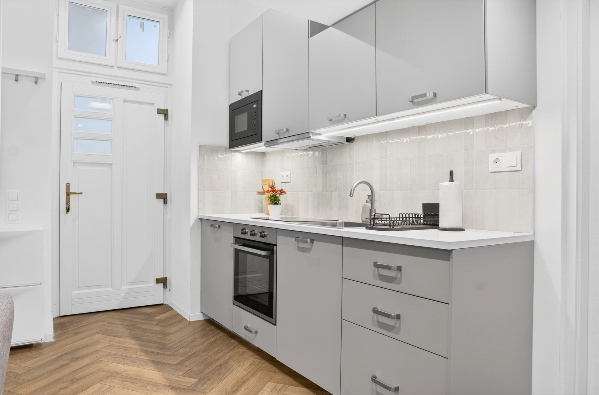 Modern grey kitchen with oven