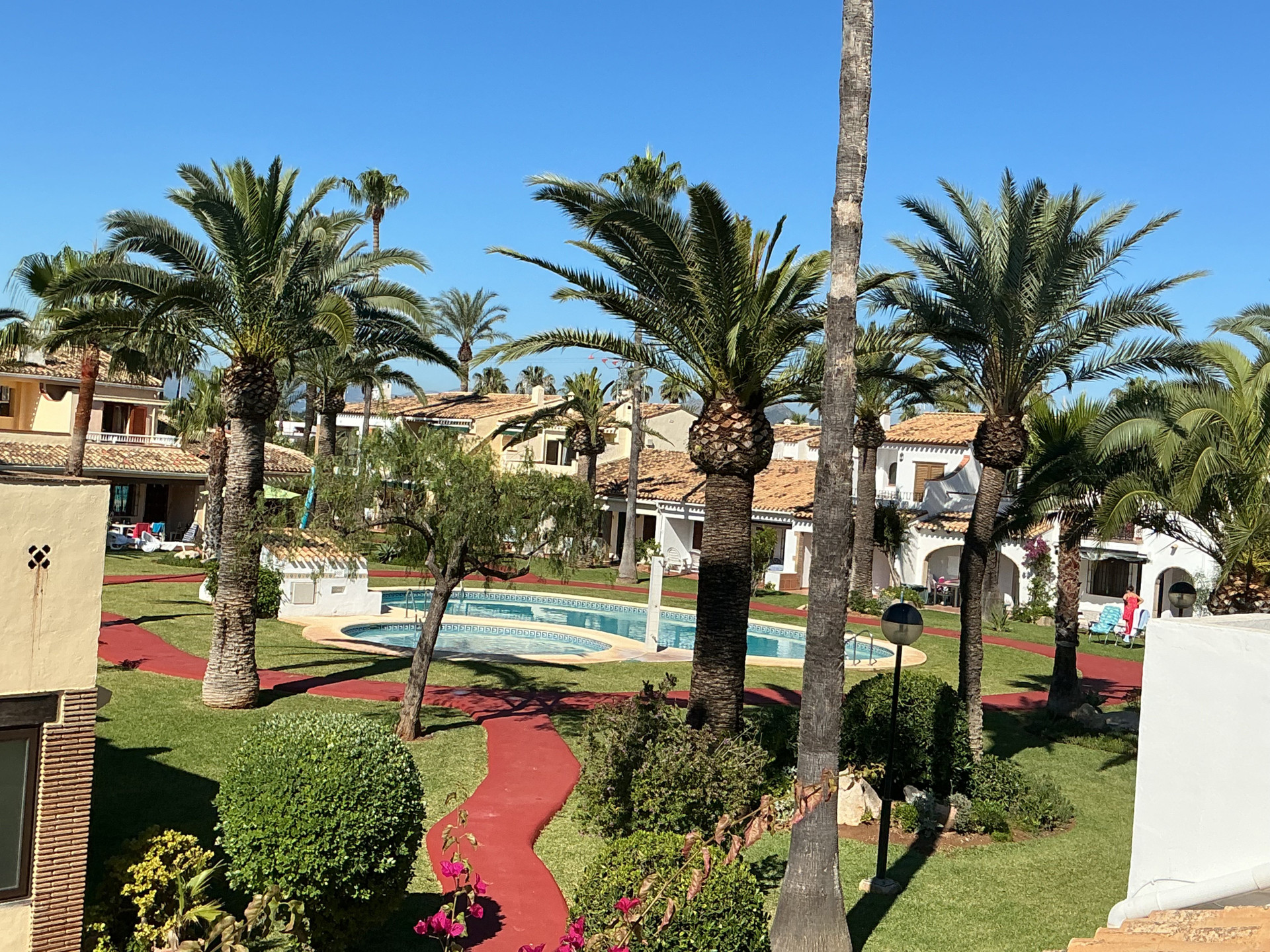 Private balcony with views over gardens and pool