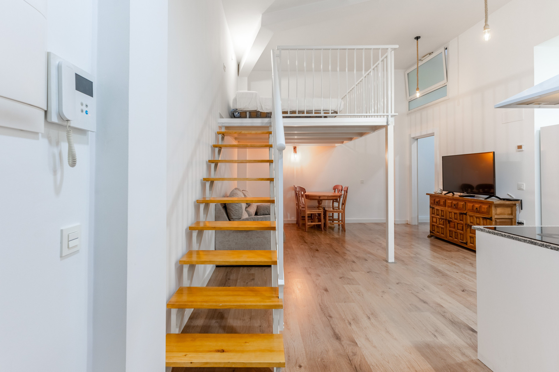 Living area with loft staircase