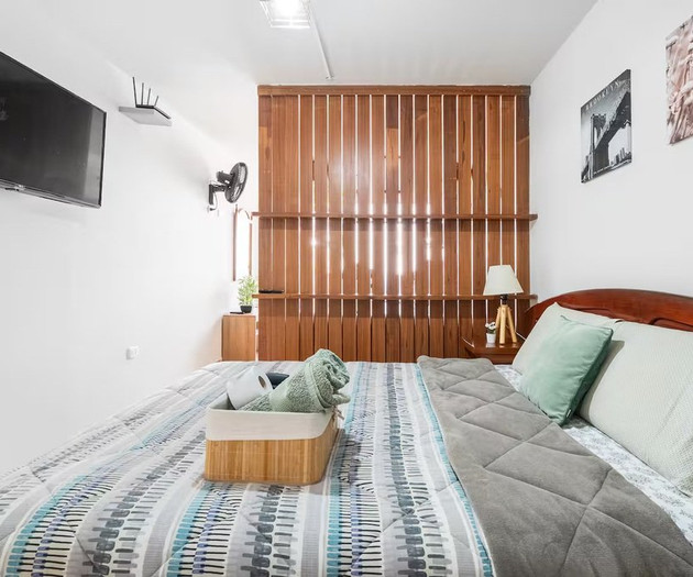 Bedroom with bed and TV
