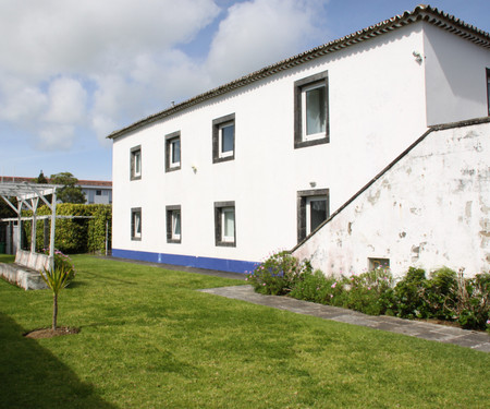 House with large balcony and garden