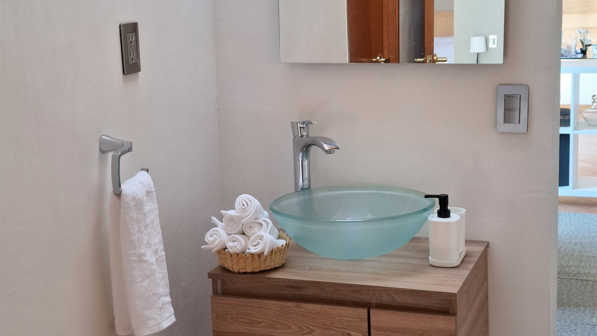 Bathroom vanity with glass bowl sink